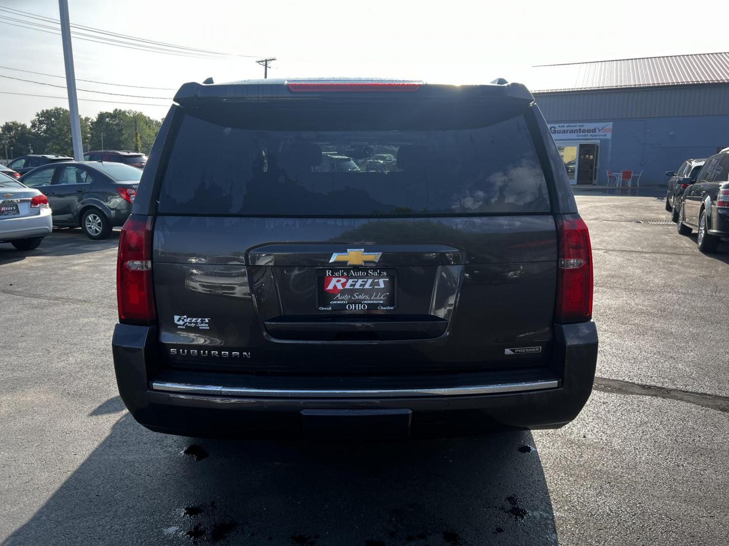 2017 Gray /Black Chevrolet Suburban Premier 4WD (1GNSKJKCXHR) with an 5.3L V8 OHV 16V engine, 6-Speed Automatic transmission, located at 547 E. Main St., Orwell, OH, 44076, (440) 437-5893, 41.535435, -80.847855 - This 2017 Chevrolet Suburban Premier 4WD is a robust full-size SUV powered by a 5.3-liter V8 Vortec engine with a 6-speed automatic transmission, offering a towing capacity of 6,000 pounds and equipped with a G80 locking rear differential and 3.08 gearing. It boasts an array of luxury and technology - Photo#9