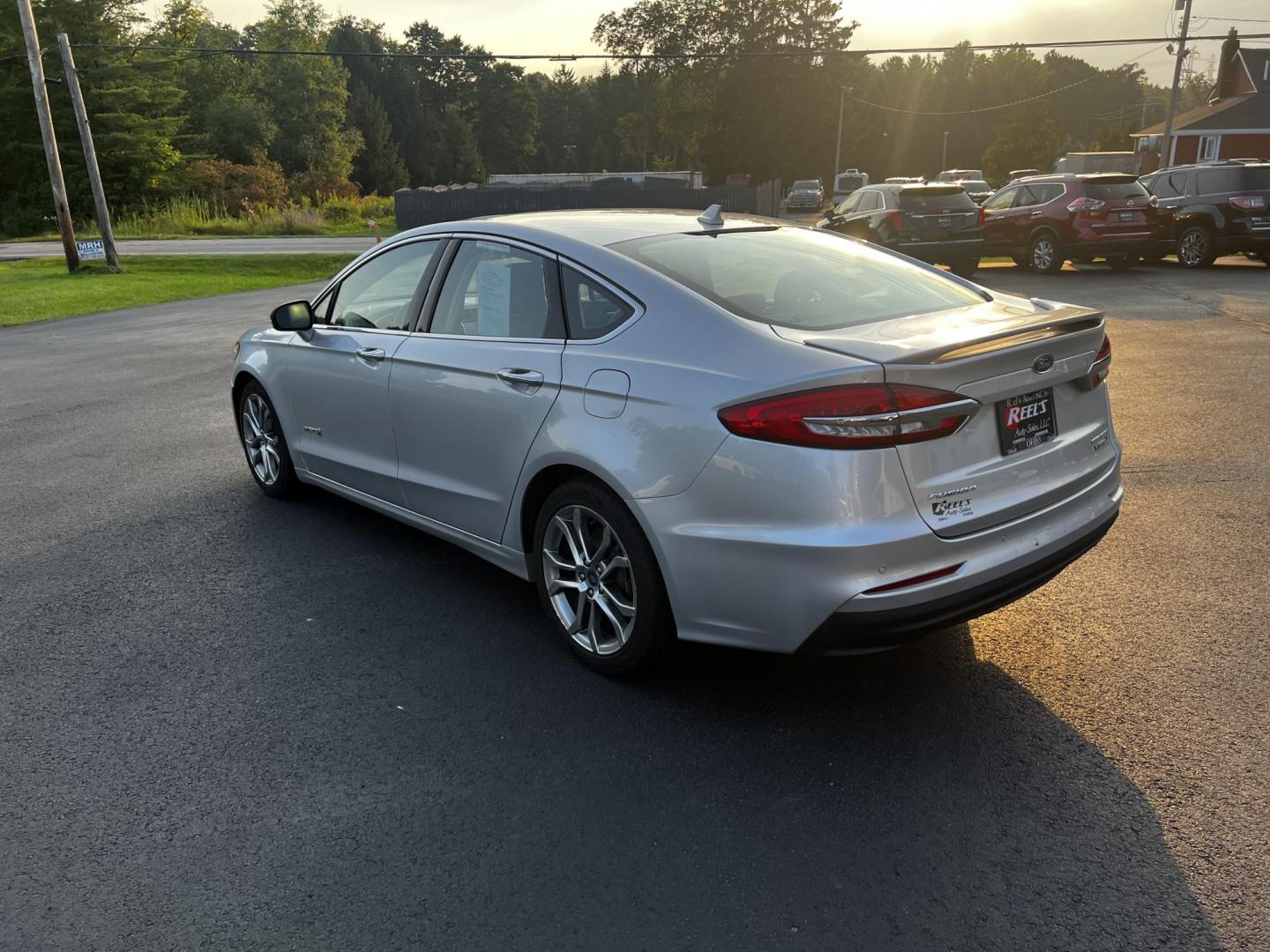 2019 Silver /Black Ford Fusion Hybrid Titanium (3FA6P0RU7KR) with an 2.0L I4 DOHC 16V HYBRID engine, CVT transmission, located at 11115 Chardon Rd. , Chardon, OH, 44024, (440) 214-9705, 41.580246, -81.241943 - This 2019 Ford Fusion Hybrid Titanium is a well-equipped midsize sedan that offers a commendable fuel efficiency of 42 MPG combined. Its exterior features full LED lighting with auto high beams, which enhances visibility and safety. The vehicle is designed with modern driver-assistance technologies - Photo#20