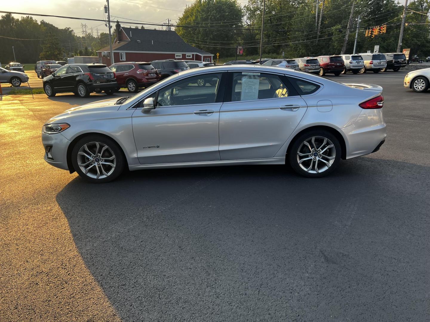 2019 Silver /Black Ford Fusion Hybrid Titanium (3FA6P0RU7KR) with an 2.0L I4 DOHC 16V HYBRID engine, CVT transmission, located at 11115 Chardon Rd. , Chardon, OH, 44024, (440) 214-9705, 41.580246, -81.241943 - This 2019 Ford Fusion Hybrid Titanium is a well-equipped midsize sedan that offers a commendable fuel efficiency of 42 MPG combined. Its exterior features full LED lighting with auto high beams, which enhances visibility and safety. The vehicle is designed with modern driver-assistance technologies - Photo#23