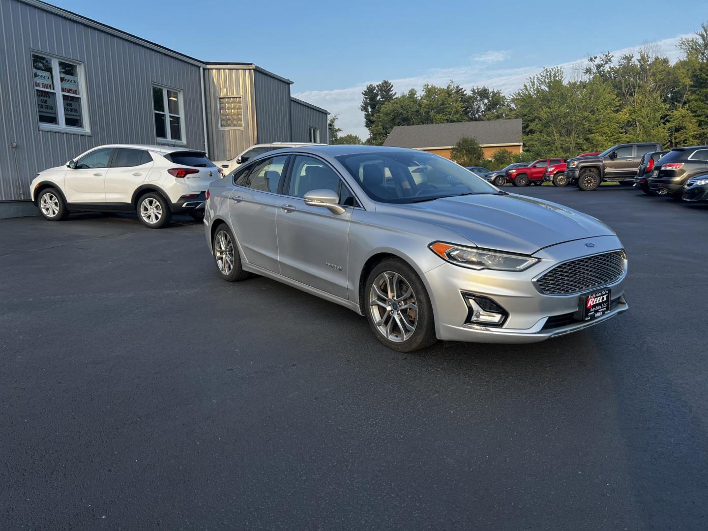 2019 Silver /Black Ford Fusion Hybrid Titanium (3FA6P0RU7KR) with an 2.0L I4 DOHC 16V HYBRID engine, CVT transmission, located at 11115 Chardon Rd. , Chardon, OH, 44024, (440) 214-9705, 41.580246, -81.241943 - This 2019 Ford Fusion Hybrid Titanium is a well-equipped midsize sedan that offers a commendable fuel efficiency of 42 MPG combined. Its exterior features full LED lighting with auto high beams, which enhances visibility and safety. The vehicle is designed with modern driver-assistance technologies - Photo#12