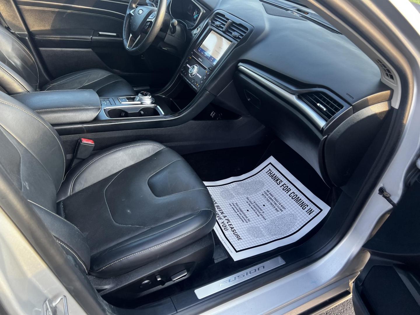 2019 Silver /Black Ford Fusion Hybrid Titanium (3FA6P0RU7KR) with an 2.0L I4 DOHC 16V HYBRID engine, CVT transmission, located at 11115 Chardon Rd. , Chardon, OH, 44024, (440) 214-9705, 41.580246, -81.241943 - This 2019 Ford Fusion Hybrid Titanium is a well-equipped midsize sedan that offers a commendable fuel efficiency of 42 MPG combined. Its exterior features full LED lighting with auto high beams, which enhances visibility and safety. The vehicle is designed with modern driver-assistance technologies - Photo#52