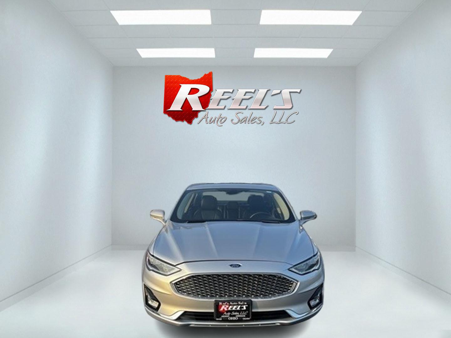 2019 Silver /Black Ford Fusion Hybrid Titanium (3FA6P0RU7KR) with an 2.0L I4 DOHC 16V HYBRID engine, CVT transmission, located at 11115 Chardon Rd. , Chardon, OH, 44024, (440) 214-9705, 41.580246, -81.241943 - This 2019 Ford Fusion Hybrid Titanium is a well-equipped midsize sedan that offers a commendable fuel efficiency of 42 MPG combined. Its exterior features full LED lighting with auto high beams, which enhances visibility and safety. The vehicle is designed with modern driver-assistance technologies - Photo#1