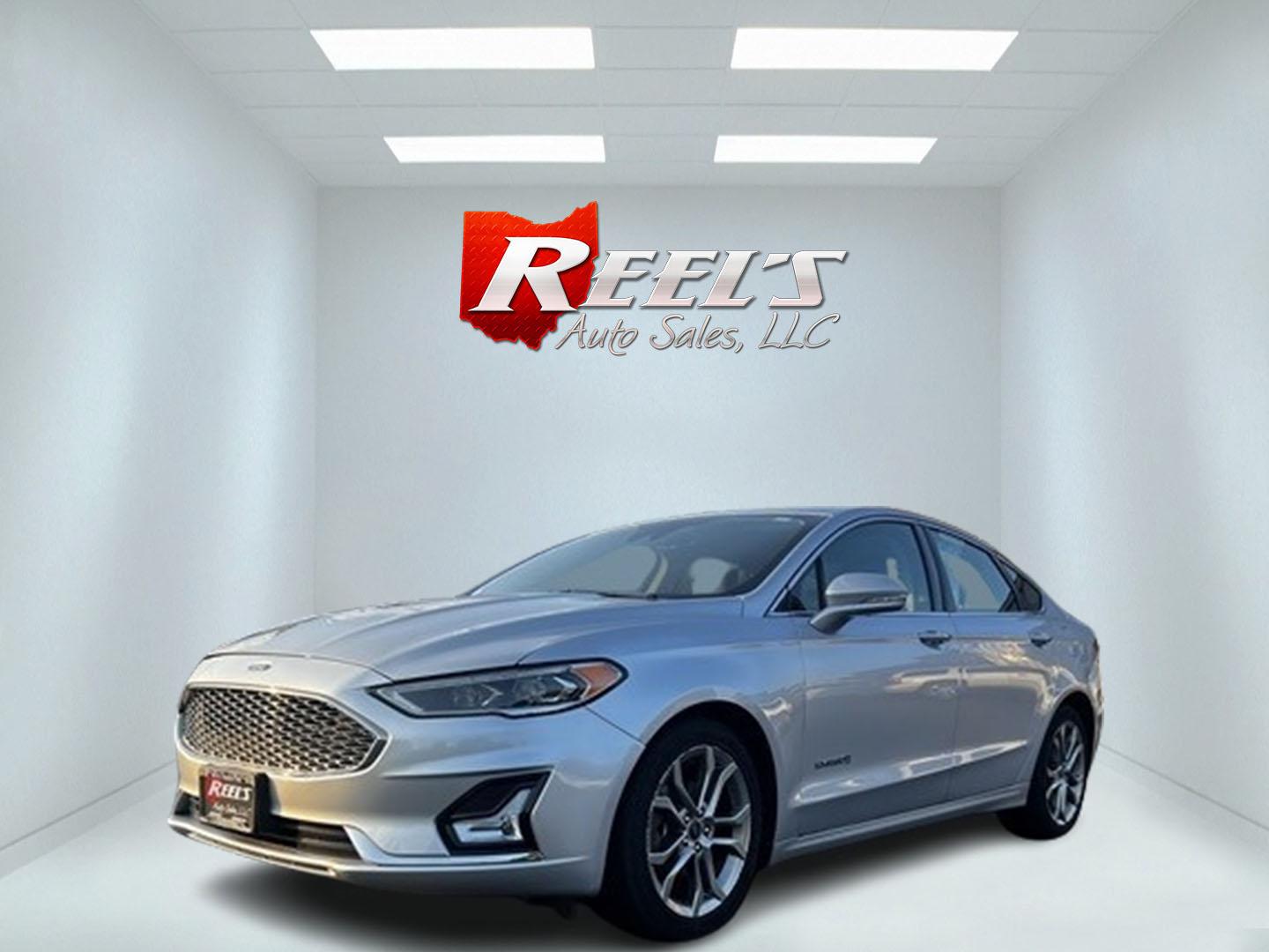 2019 Silver /Black Ford Fusion Hybrid Titanium (3FA6P0RU7KR) with an 2.0L I4 DOHC 16V HYBRID engine, CVT transmission, located at 11115 Chardon Rd. , Chardon, OH, 44024, (440) 214-9705, 41.580246, -81.241943 - This 2019 Ford Fusion Hybrid Titanium is a well-equipped midsize sedan that offers a commendable fuel efficiency of 42 MPG combined. Its exterior features full LED lighting with auto high beams, which enhances visibility and safety. The vehicle is designed with modern driver-assistance technologies - Photo#0