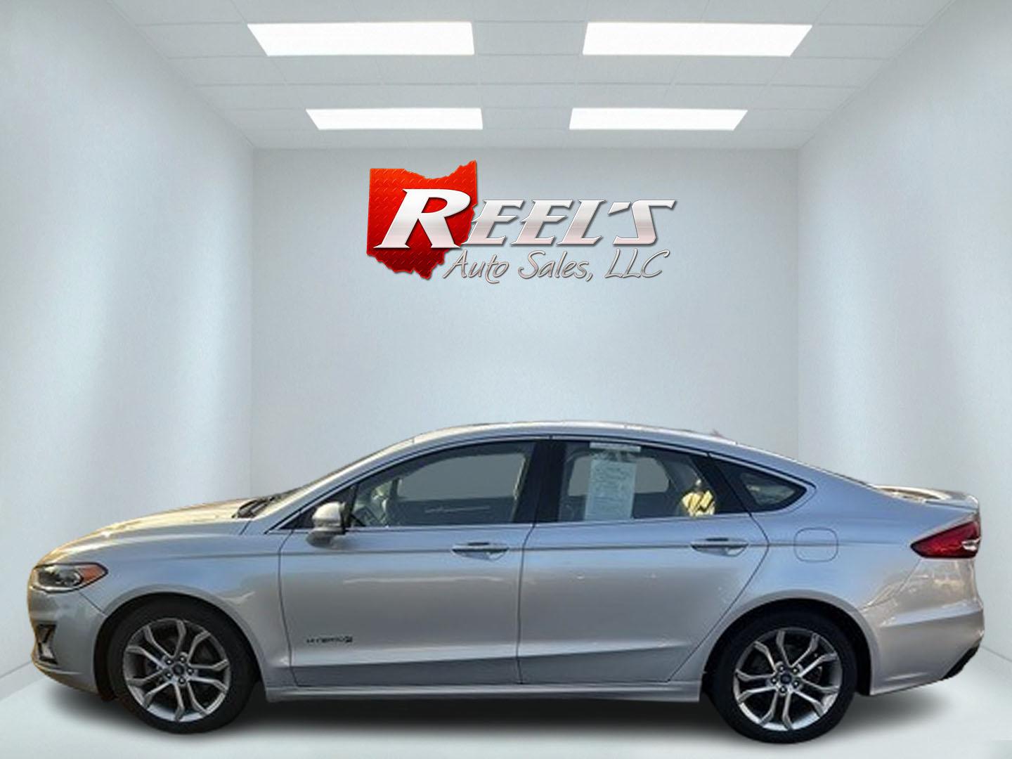 2019 Silver /Black Ford Fusion Hybrid Titanium (3FA6P0RU7KR) with an 2.0L I4 DOHC 16V HYBRID engine, CVT transmission, located at 11115 Chardon Rd. , Chardon, OH, 44024, (440) 214-9705, 41.580246, -81.241943 - This 2019 Ford Fusion Hybrid Titanium is a well-equipped midsize sedan that offers a commendable fuel efficiency of 42 MPG combined. Its exterior features full LED lighting with auto high beams, which enhances visibility and safety. The vehicle is designed with modern driver-assistance technologies - Photo#8