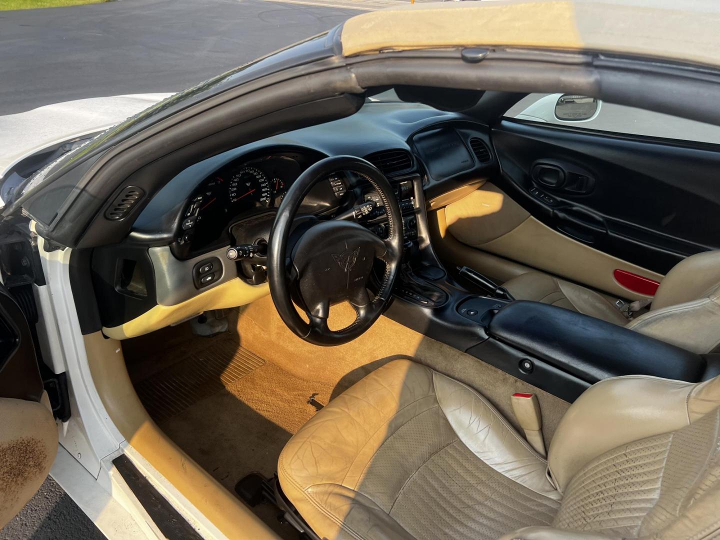 2001 /Tan Chevrolet Corvette Convertible (1G1YY32G815) with an 5.7L V8 OHV 16V engine, 4-Speed Automatic transmission, located at 11115 Chardon Rd. , Chardon, OH, 44024, (440) 214-9705, 41.580246, -81.241943 - This 2001 Chevrolet Corvette is a performance-driven sports car that combines power and comfort elegantly. It is equipped with a robust 5.7L V8 engine that delivers a potent 350 horsepower, enabling impressive acceleration of 0-60 mph in just 5.3 seconds, paired with a 4-speed automatic transmission - Photo#15