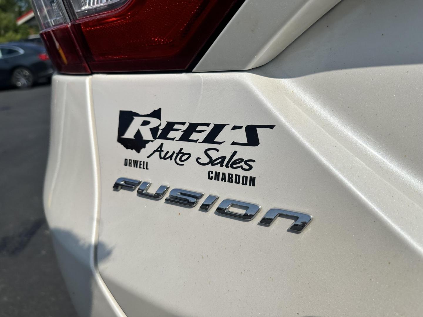 2013 White /Black Ford Fusion SE (3FA6P0H96DR) with an 2.0L I4 DOHC 16V Turbo engine, 6-Speed Automatic transmission, located at 547 E. Main St., Orwell, OH, 44076, (440) 437-5893, 41.535435, -80.847855 - This 2013 Ford Fusion SE with the 2.0 I4 EcoBoost engine and 6-speed automatic transmission offers a well-rounded driving experience with a blend of performance and efficiency, achieving 26 MPG combined and 33 MPG on the highway. It features a range of comfort and safety technologies, including leat - Photo#34