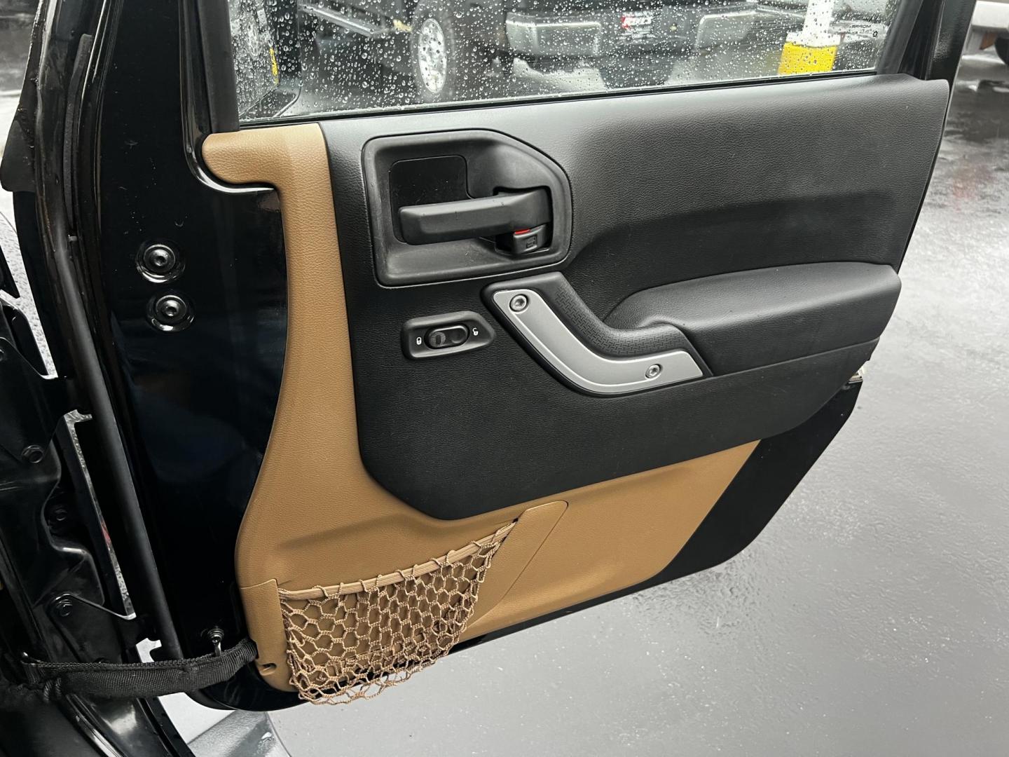 2014 Black /Brown Jeep Wrangler Unlimited Sahara 4WD (1C4BJWEG2EL) with an 3.6L V6 DOHC 24V engine, 5 Speed Auto transmission, located at 547 E. Main St., Orwell, OH, 44076, (440) 437-5893, 41.535435, -80.847855 - This 2014 Jeep Wrangler Unlimited Sahara combines rugged capability with a touch of luxury, catering to adventure enthusiasts who also enjoy comfort. Powered by a 3.6-liter Pentastar V6 engine paired with a 5-speed automatic transmission, it offers robust performance perfect for off-road escapades a - Photo#37