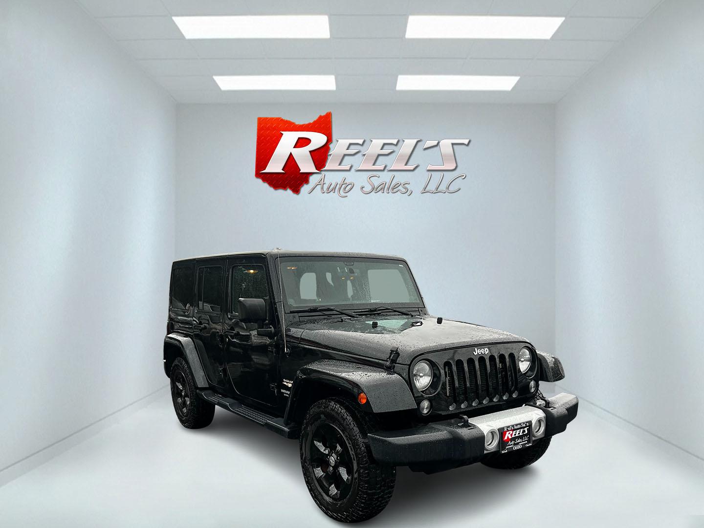 2014 Black /Brown Jeep Wrangler Unlimited Sahara 4WD (1C4BJWEG2EL) with an 3.6L V6 DOHC 24V engine, 5 Speed Auto transmission, located at 547 E. Main St., Orwell, OH, 44076, (440) 437-5893, 41.535435, -80.847855 - This 2014 Jeep Wrangler Unlimited Sahara combines rugged capability with a touch of luxury, catering to adventure enthusiasts who also enjoy comfort. Powered by a 3.6-liter Pentastar V6 engine paired with a 5-speed automatic transmission, it offers robust performance perfect for off-road escapades a - Photo#2