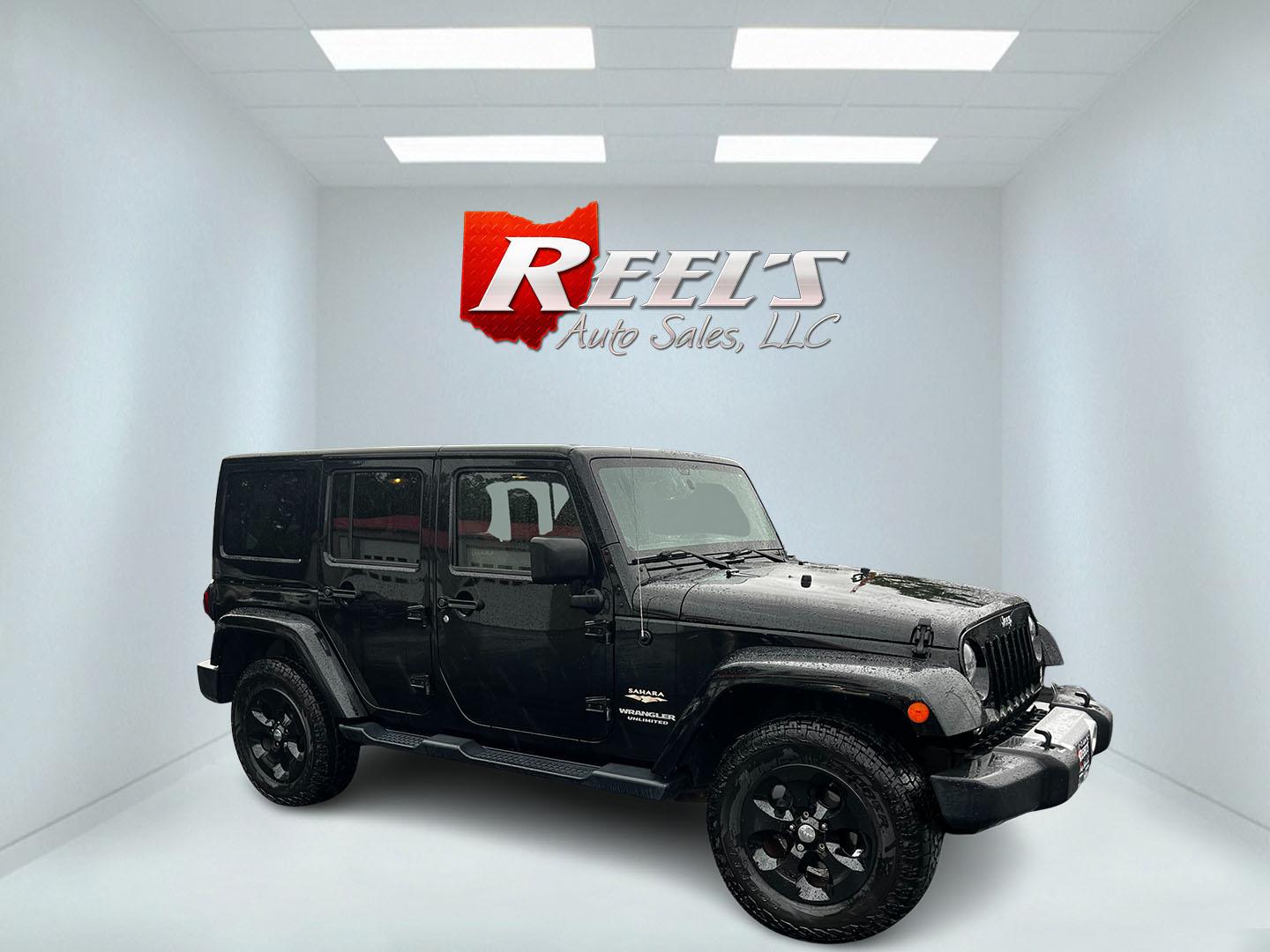 2014 Black /Brown Jeep Wrangler Unlimited Sahara 4WD (1C4BJWEG2EL) with an 3.6L V6 DOHC 24V engine, 5 Speed Auto transmission, located at 547 E. Main St., Orwell, OH, 44076, (440) 437-5893, 41.535435, -80.847855 - This 2014 Jeep Wrangler Unlimited Sahara combines rugged capability with a touch of luxury, catering to adventure enthusiasts who also enjoy comfort. Powered by a 3.6-liter Pentastar V6 engine paired with a 5-speed automatic transmission, it offers robust performance perfect for off-road escapades a - Photo#3