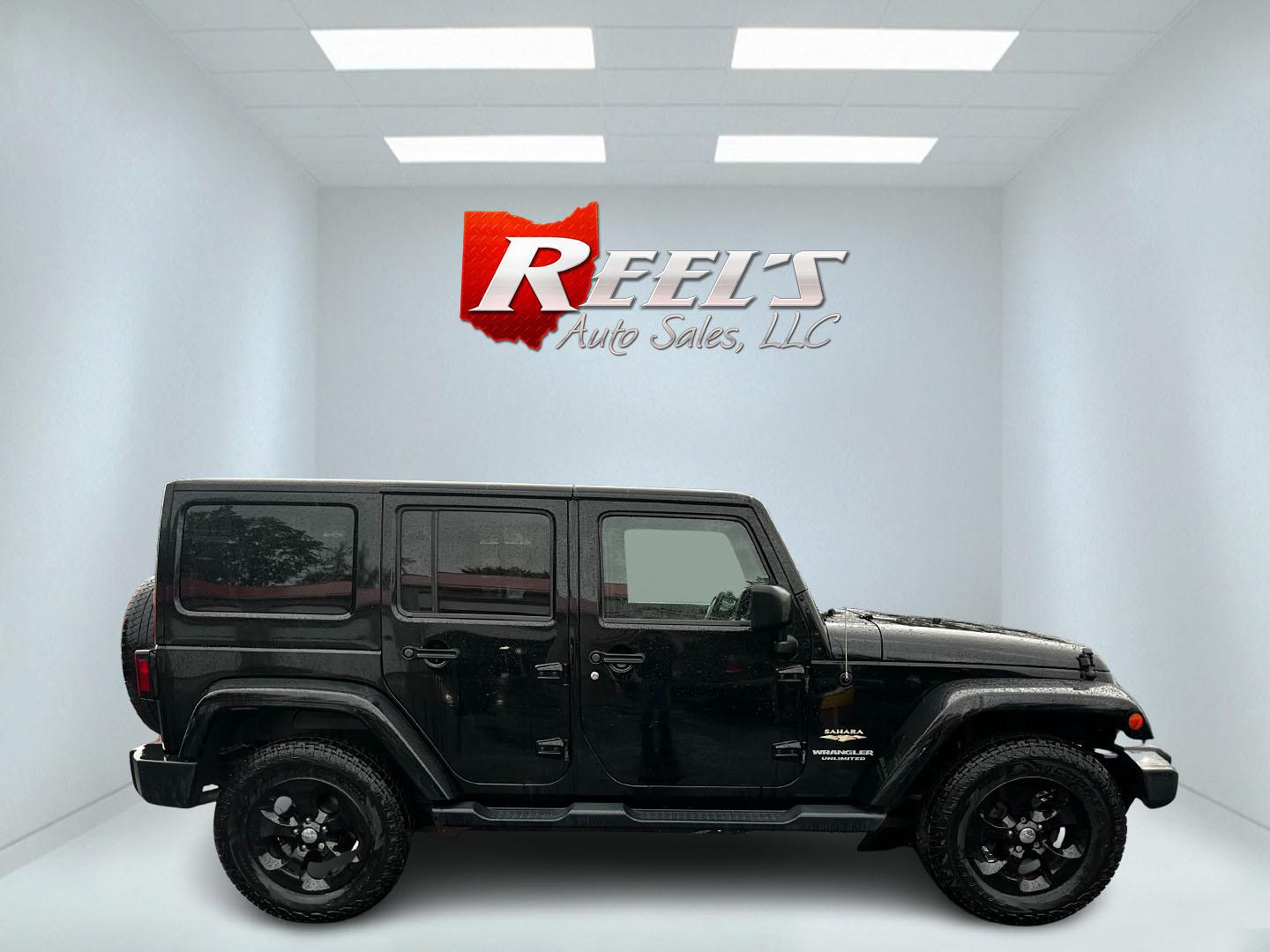 2014 Black /Brown Jeep Wrangler Unlimited Sahara 4WD (1C4BJWEG2EL) with an 3.6L V6 DOHC 24V engine, 5 Speed Auto transmission, located at 547 E. Main St., Orwell, OH, 44076, (440) 437-5893, 41.535435, -80.847855 - This 2014 Jeep Wrangler Unlimited Sahara combines rugged capability with a touch of luxury, catering to adventure enthusiasts who also enjoy comfort. Powered by a 3.6-liter Pentastar V6 engine paired with a 5-speed automatic transmission, it offers robust performance perfect for off-road escapades a - Photo#4