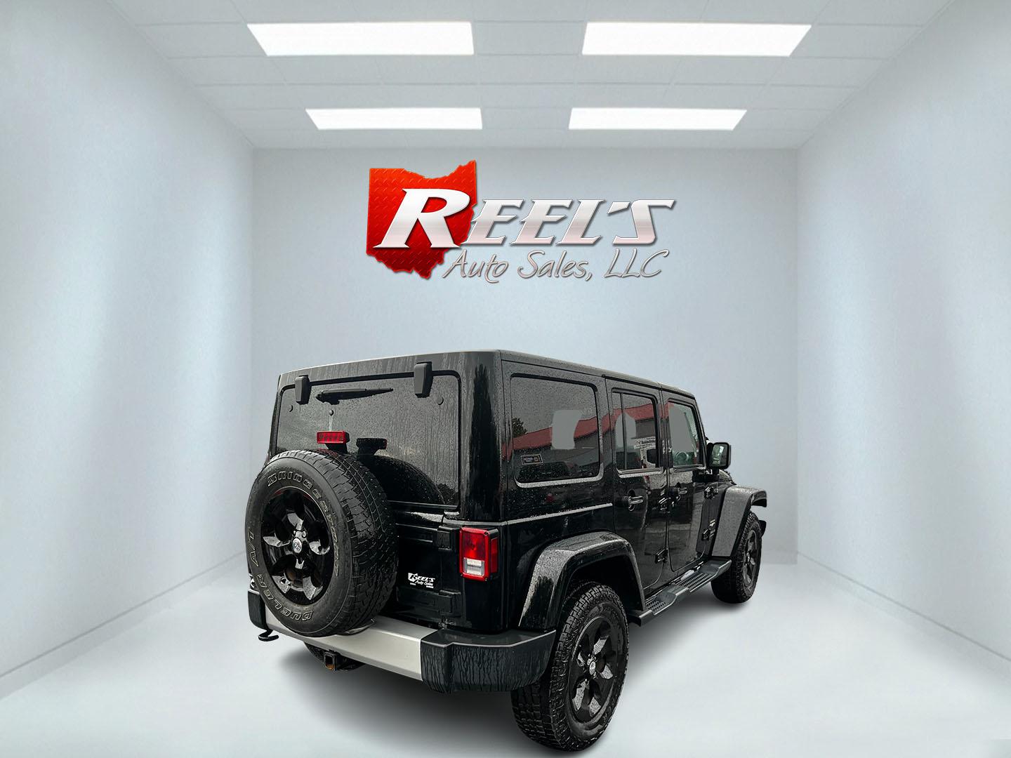 2014 Black /Brown Jeep Wrangler Unlimited Sahara 4WD (1C4BJWEG2EL) with an 3.6L V6 DOHC 24V engine, 5 Speed Auto transmission, located at 547 E. Main St., Orwell, OH, 44076, (440) 437-5893, 41.535435, -80.847855 - This 2014 Jeep Wrangler Unlimited Sahara combines rugged capability with a touch of luxury, catering to adventure enthusiasts who also enjoy comfort. Powered by a 3.6-liter Pentastar V6 engine paired with a 5-speed automatic transmission, it offers robust performance perfect for off-road escapades a - Photo#5