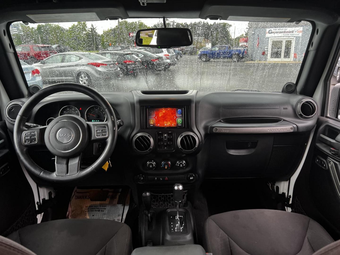 2014 White /Black Jeep Wrangler Unlimited Sport 4WD (1C4BJWDG3EL) with an 3.6L V6 DOHC 24V engine, 5 Speed Auto transmission, located at 547 E. Main St., Orwell, OH, 44076, (440) 437-5893, 41.535435, -80.847855 - This 2014 Jeep Wrangler Unlimited Sport is built for those who enjoy both adventure and practicality, featuring robust off-road capabilities and essential modern features. It's equipped with a 3.6-liter Pentastar V6 engine and a 5-speed automatic transmission, delivering reliable power and performan - Photo#31