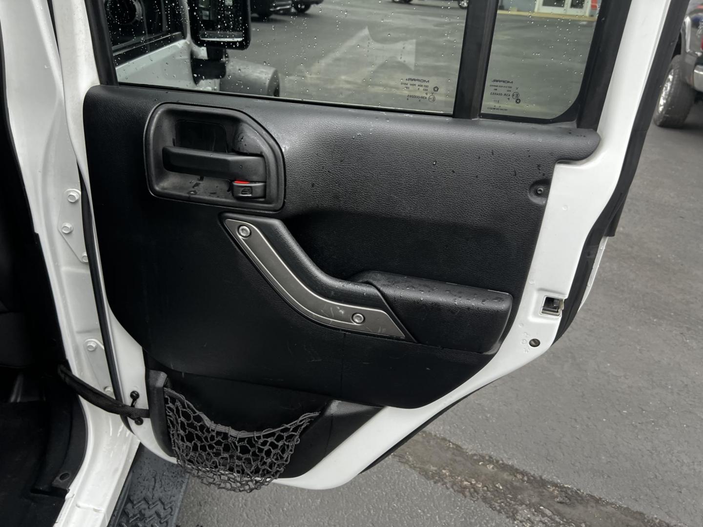 2014 White /Black Jeep Wrangler Unlimited Sport 4WD (1C4BJWDG3EL) with an 3.6L V6 DOHC 24V engine, 5 Speed Auto transmission, located at 547 E. Main St., Orwell, OH, 44076, (440) 437-5893, 41.535435, -80.847855 - This 2014 Jeep Wrangler Unlimited Sport is built for those who enjoy both adventure and practicality, featuring robust off-road capabilities and essential modern features. It's equipped with a 3.6-liter Pentastar V6 engine and a 5-speed automatic transmission, delivering reliable power and performan - Photo#34