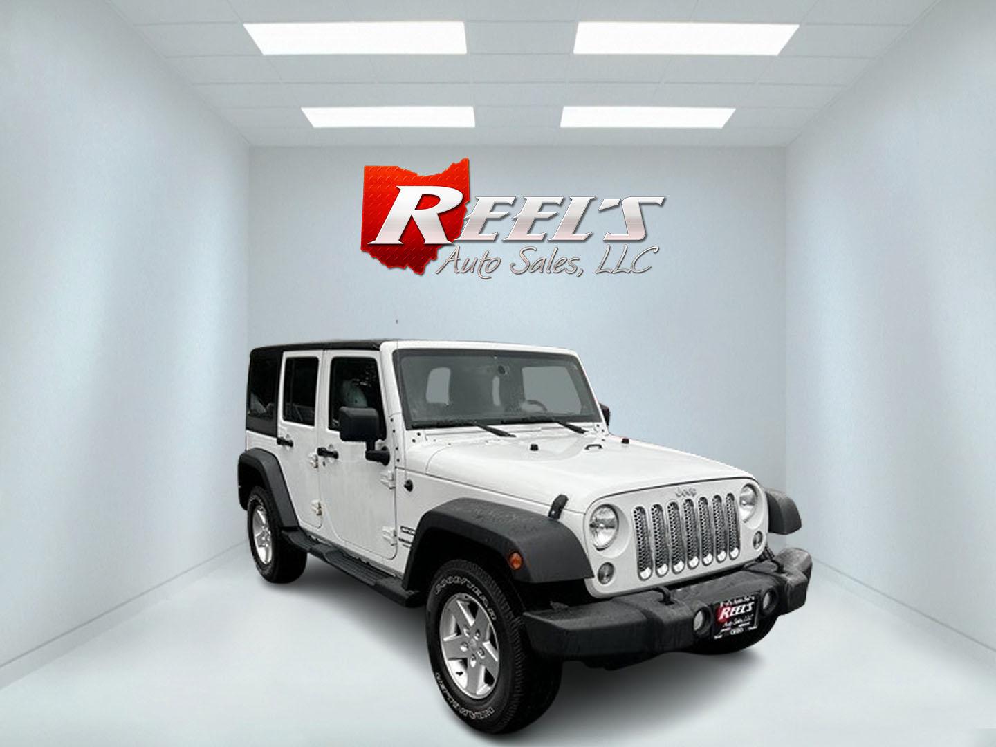 2014 White /Black Jeep Wrangler Unlimited Sport 4WD (1C4BJWDG3EL) with an 3.6L V6 DOHC 24V engine, 5 Speed Auto transmission, located at 547 E. Main St., Orwell, OH, 44076, (440) 437-5893, 41.535435, -80.847855 - This 2014 Jeep Wrangler Unlimited Sport is built for those who enjoy both adventure and practicality, featuring robust off-road capabilities and essential modern features. It's equipped with a 3.6-liter Pentastar V6 engine and a 5-speed automatic transmission, delivering reliable power and performan - Photo#2