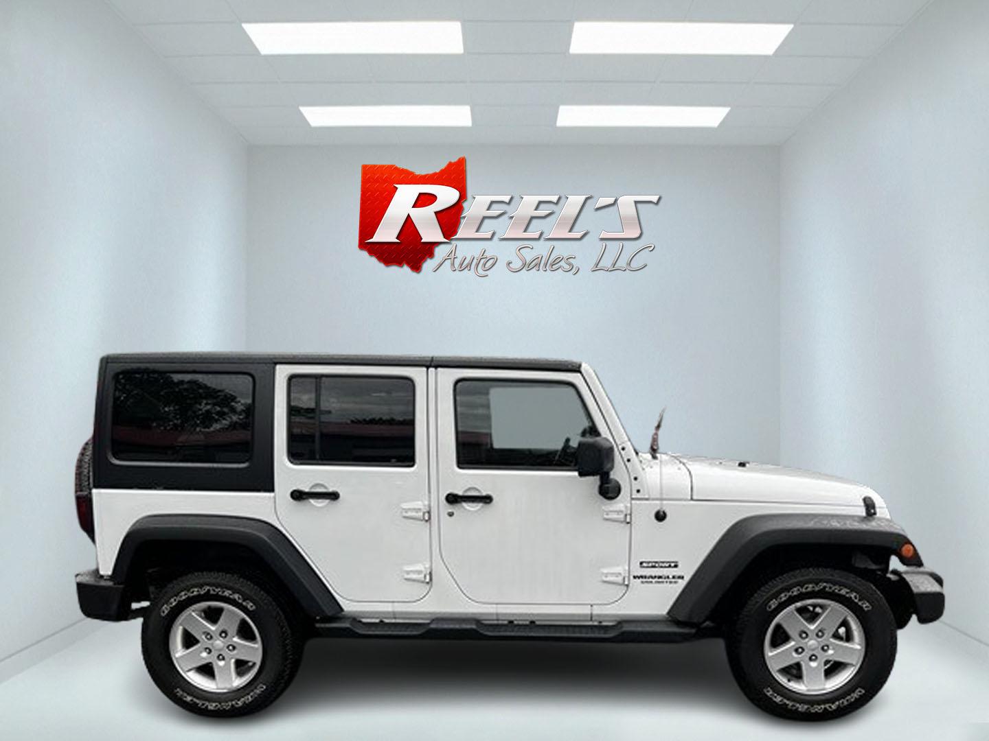 2014 White /Black Jeep Wrangler Unlimited Sport 4WD (1C4BJWDG3EL) with an 3.6L V6 DOHC 24V engine, 5 Speed Auto transmission, located at 547 E. Main St., Orwell, OH, 44076, (440) 437-5893, 41.535435, -80.847855 - This 2014 Jeep Wrangler Unlimited Sport is built for those who enjoy both adventure and practicality, featuring robust off-road capabilities and essential modern features. It's equipped with a 3.6-liter Pentastar V6 engine and a 5-speed automatic transmission, delivering reliable power and performan - Photo#4