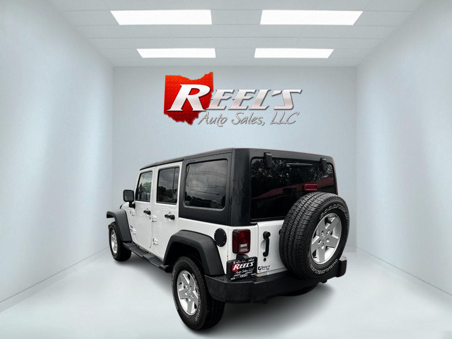 2014 White /Black Jeep Wrangler Unlimited Sport 4WD (1C4BJWDG3EL) with an 3.6L V6 DOHC 24V engine, 5 Speed Auto transmission, located at 547 E. Main St., Orwell, OH, 44076, (440) 437-5893, 41.535435, -80.847855 - This 2014 Jeep Wrangler Unlimited Sport is built for those who enjoy both adventure and practicality, featuring robust off-road capabilities and essential modern features. It's equipped with a 3.6-liter Pentastar V6 engine and a 5-speed automatic transmission, delivering reliable power and performan - Photo#7