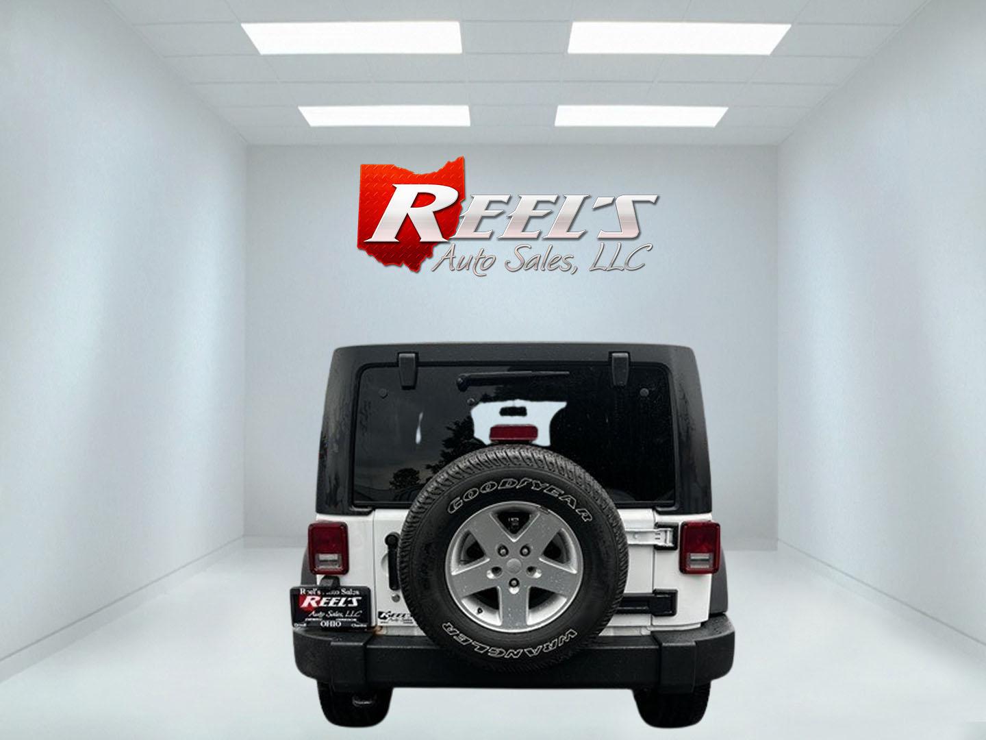 2014 White /Black Jeep Wrangler Unlimited Sport 4WD (1C4BJWDG3EL) with an 3.6L V6 DOHC 24V engine, 5 Speed Auto transmission, located at 547 E. Main St., Orwell, OH, 44076, (440) 437-5893, 41.535435, -80.847855 - This 2014 Jeep Wrangler Unlimited Sport is built for those who enjoy both adventure and practicality, featuring robust off-road capabilities and essential modern features. It's equipped with a 3.6-liter Pentastar V6 engine and a 5-speed automatic transmission, delivering reliable power and performan - Photo#6