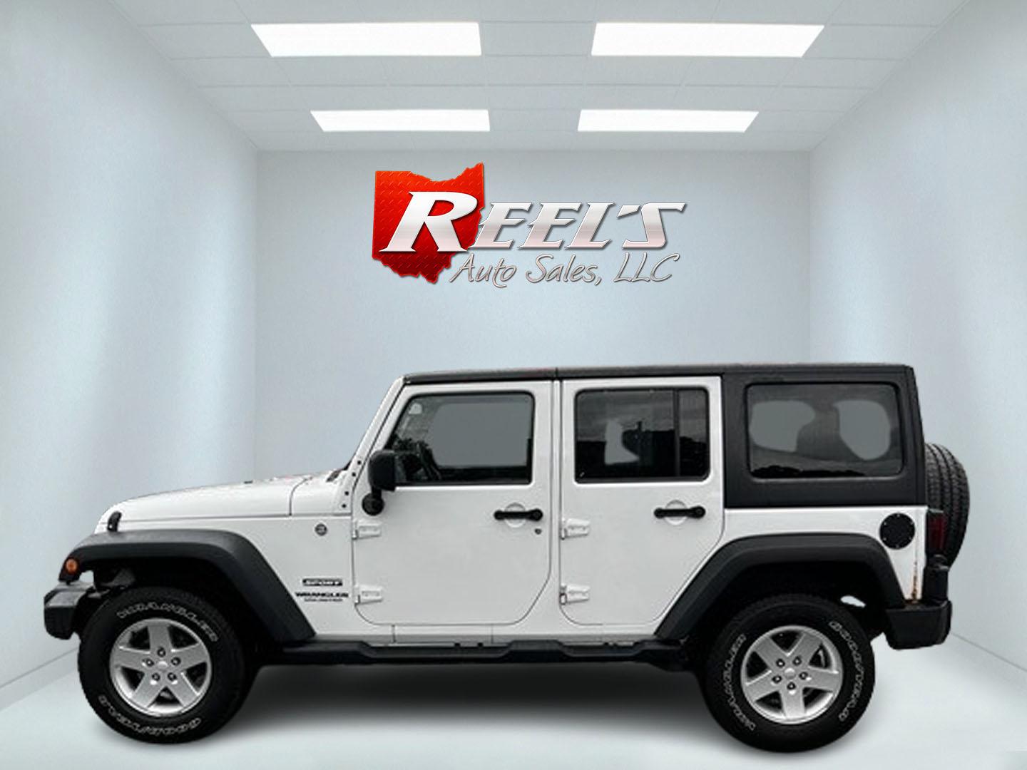 2014 White /Black Jeep Wrangler Unlimited Sport 4WD (1C4BJWDG3EL) with an 3.6L V6 DOHC 24V engine, 5 Speed Auto transmission, located at 547 E. Main St., Orwell, OH, 44076, (440) 437-5893, 41.535435, -80.847855 - This 2014 Jeep Wrangler Unlimited Sport is built for those who enjoy both adventure and practicality, featuring robust off-road capabilities and essential modern features. It's equipped with a 3.6-liter Pentastar V6 engine and a 5-speed automatic transmission, delivering reliable power and performan - Photo#9