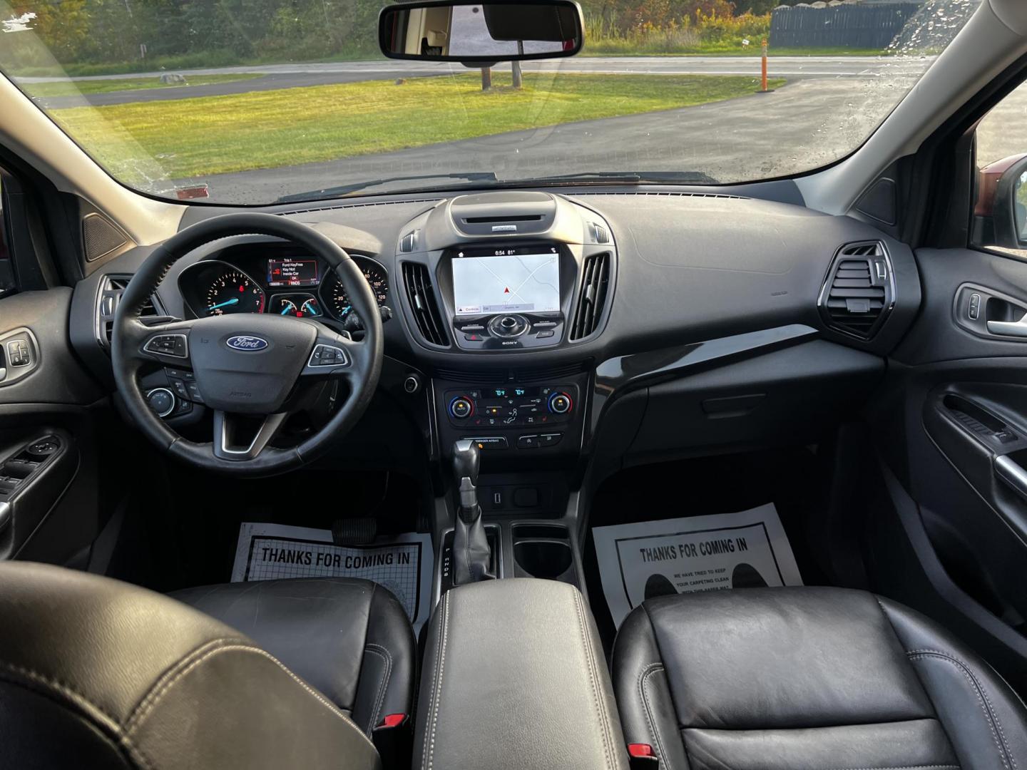 2017 Red /Black Ford Escape Titanium 4WD (1FMCU9JDXHU) with an 1.5L I4 DOHC 16V TURBO engine, 6 Speed Automatic transmission, located at 547 E. Main St., Orwell, OH, 44076, (440) 437-5893, 41.535435, -80.847855 - This 2017 Ford Escape Titanium 4WD is a well-equipped compact SUV that offers a balance of performance and comfort. Powered by a turbocharged 1.5-liter EcoBoost I4 engine paired with a 6-speed automatic transmission, it delivers a commendable 28 MPG on the highway, making it an efficient choice for - Photo#33