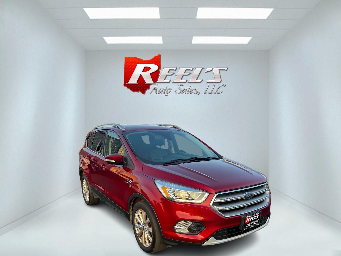 2017 Red /Black Ford Escape Titanium 4WD (1FMCU9JDXHU) with an 1.5L I4 DOHC 16V TURBO engine, 6 Speed Automatic transmission, located at 547 E. Main St., Orwell, OH, 44076, (440) 437-5893, 41.535435, -80.847855 - This 2017 Ford Escape Titanium 4WD is a well-equipped compact SUV that offers a balance of performance and comfort. Powered by a turbocharged 1.5-liter EcoBoost I4 engine paired with a 6-speed automatic transmission, it delivers a commendable 28 MPG on the highway, making it an efficient choice for - Photo#2