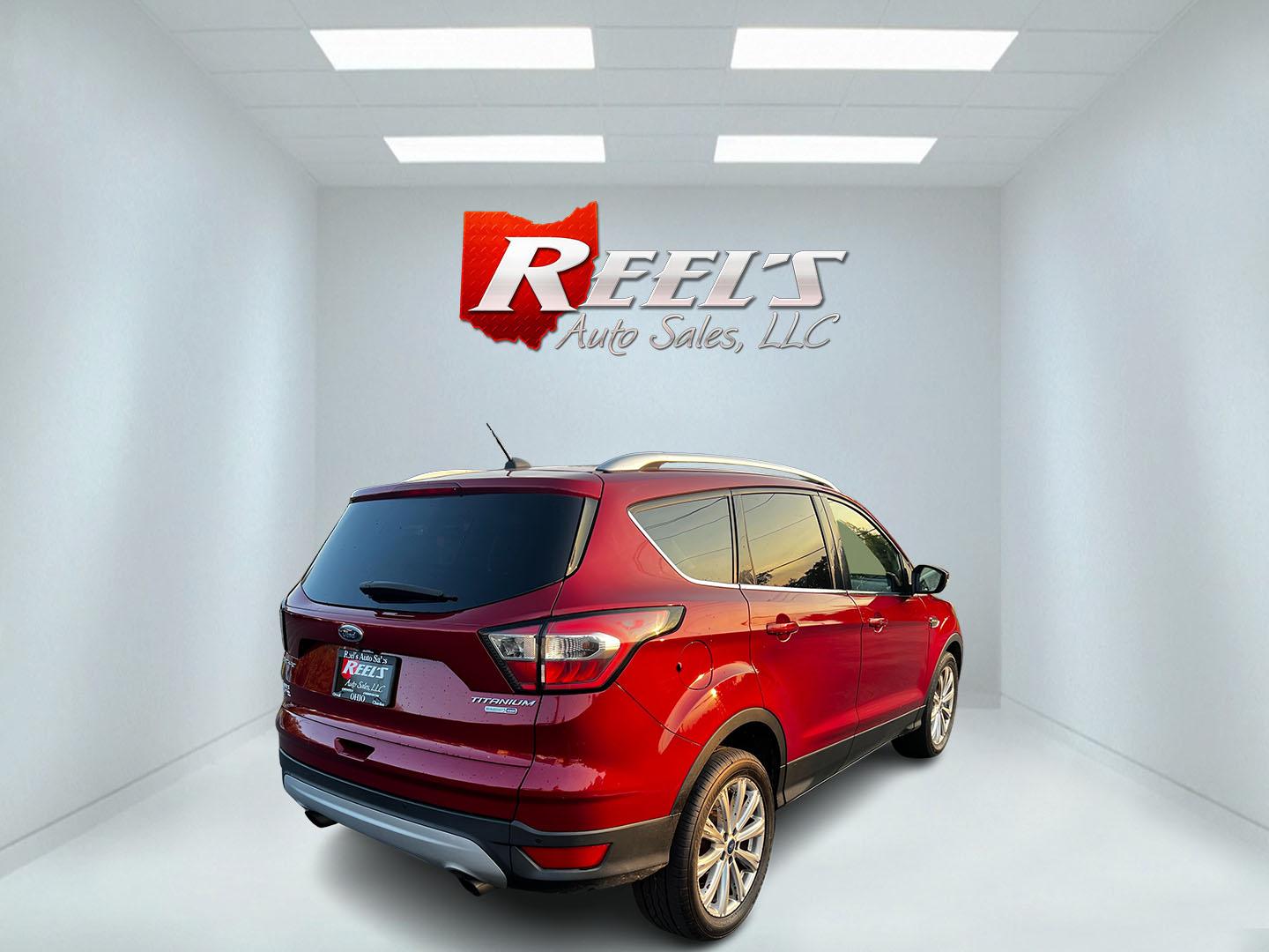 2017 Red /Black Ford Escape Titanium 4WD (1FMCU9JDXHU) with an 1.5L I4 DOHC 16V TURBO engine, 6 Speed Automatic transmission, located at 547 E. Main St., Orwell, OH, 44076, (440) 437-5893, 41.535435, -80.847855 - This 2017 Ford Escape Titanium 4WD is a well-equipped compact SUV that offers a balance of performance and comfort. Powered by a turbocharged 1.5-liter EcoBoost I4 engine paired with a 6-speed automatic transmission, it delivers a commendable 28 MPG on the highway, making it an efficient choice for - Photo#5