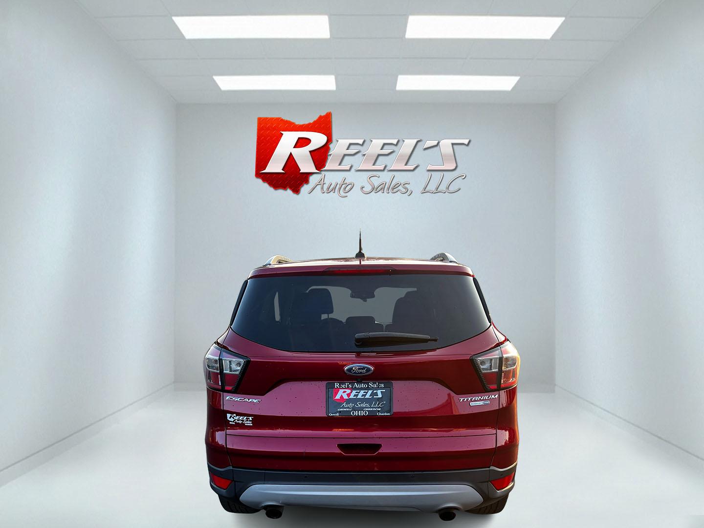 2017 Red /Black Ford Escape Titanium 4WD (1FMCU9JDXHU) with an 1.5L I4 DOHC 16V TURBO engine, 6 Speed Automatic transmission, located at 547 E. Main St., Orwell, OH, 44076, (440) 437-5893, 41.535435, -80.847855 - This 2017 Ford Escape Titanium 4WD is a well-equipped compact SUV that offers a balance of performance and comfort. Powered by a turbocharged 1.5-liter EcoBoost I4 engine paired with a 6-speed automatic transmission, it delivers a commendable 28 MPG on the highway, making it an efficient choice for - Photo#6