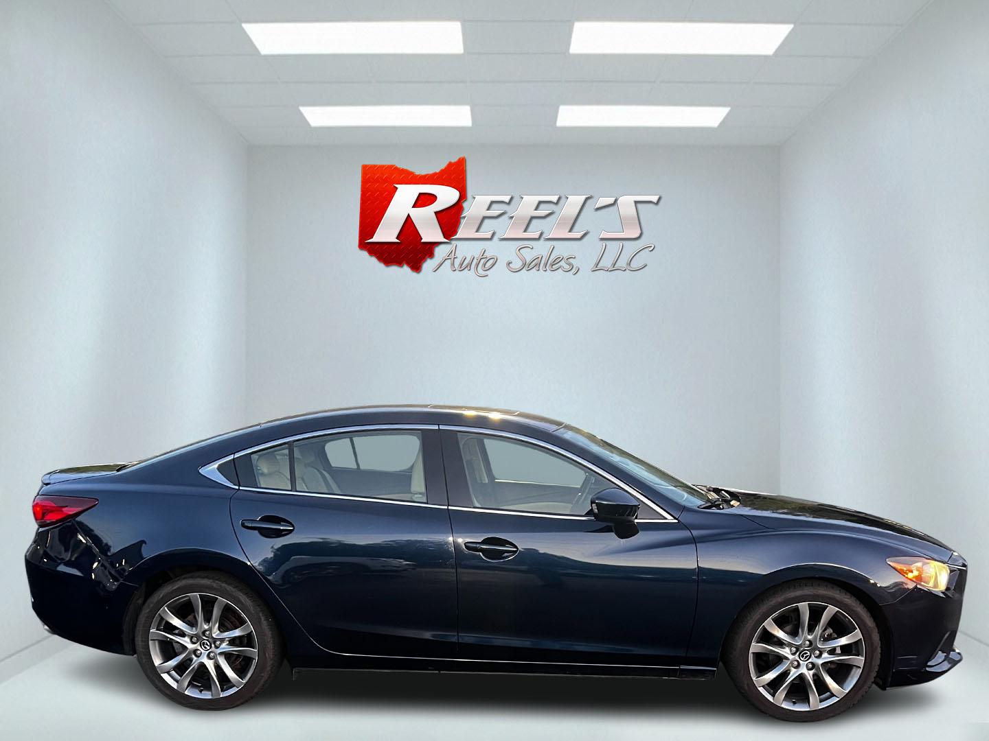 2015 Blue /Tan Mazda Mazda6 i Grand Touring (JM1GJ1W52F1) with an 2.5L I4 DOHC 16V engine, 6-Speed Automatic transmission, located at 547 E. Main St., Orwell, OH, 44076, (440) 437-5893, 41.535435, -80.847855 - This One Owner 2015 Mazda6 Grand Touring is a mid-sized sedan that combines performance, luxury, and technology. Powered by a 2.5-liter I4 engine paired with a 6-speed automatic transmission, it provides a smooth and efficient drive, boasting an impressive 39 MPG on the highway. The interior is well - Photo#4