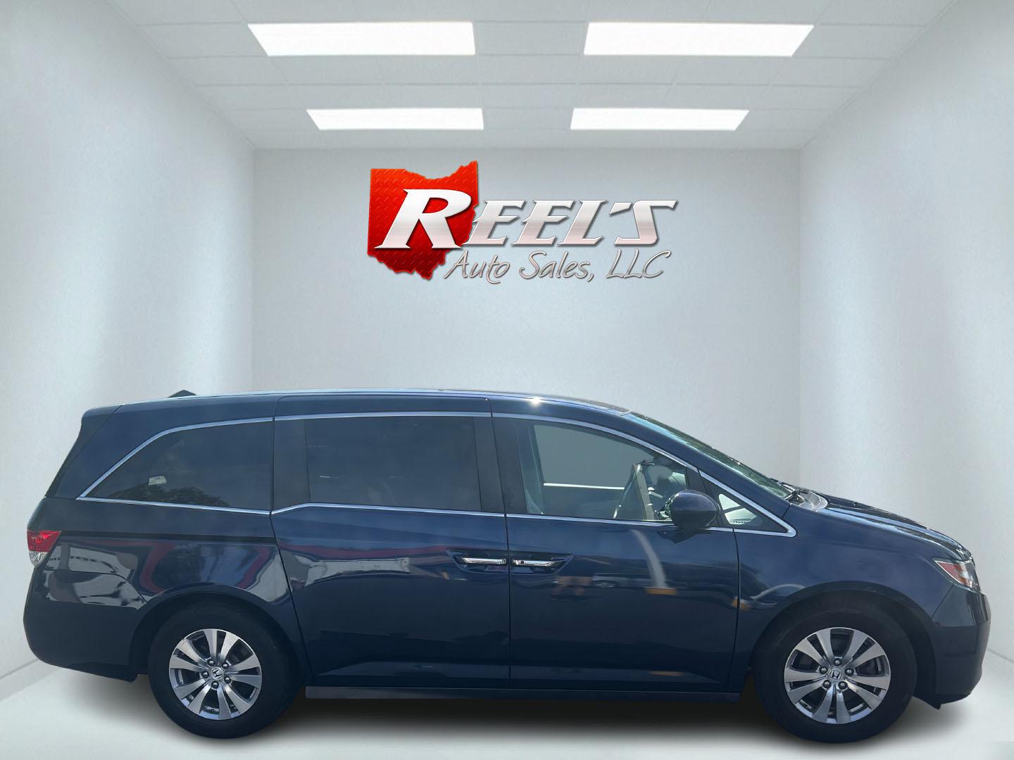 2014 Blue /Gray Honda Odyssey EX (5FNRL5H43EB) with an 3.5L V6 SOHC 24V engine, 6-Speed Automatic transmission, located at 547 E. Main St., Orwell, OH, 44076, (440) 437-5893, 41.535435, -80.847855 - Photo#4