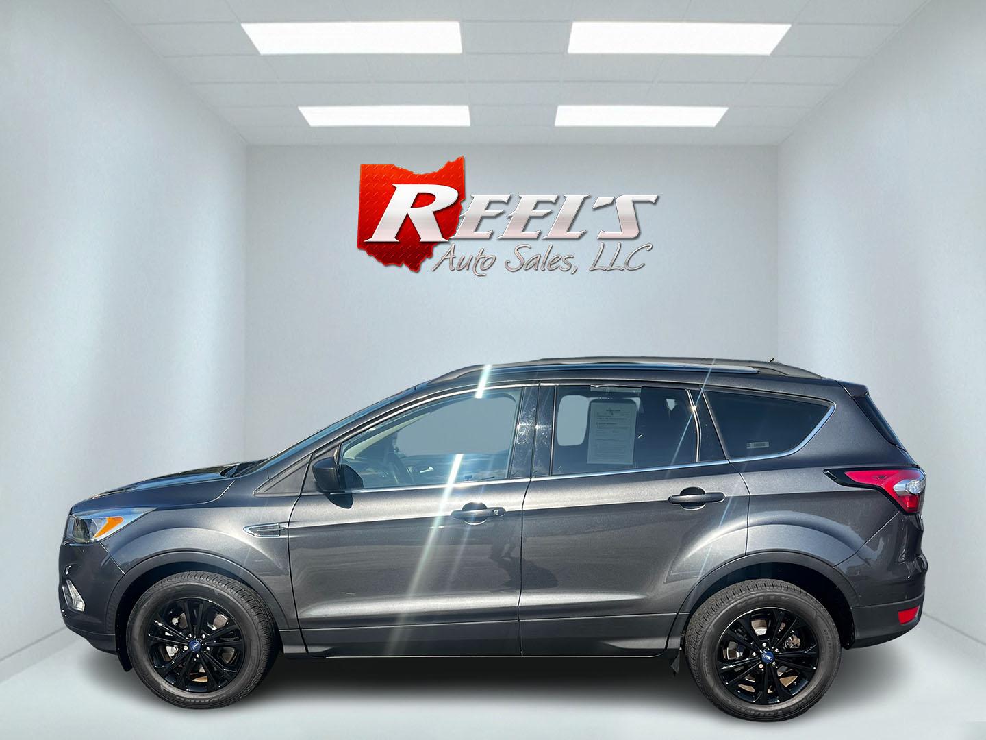 2018 Gray /Black Ford Escape SE 4WD (1FMCU9GD0JU) with an 1.5L I4 DOHC 16V TURBO engine, 6 Speed Auto transmission, located at 11115 Chardon Rd. , Chardon, OH, 44024, (440) 214-9705, 41.580246, -81.241943 - This 2018 Ford Escape SE 4WD is a compact SUV designed for efficiency and comfort, powered by a 1.5-liter turbocharged I4 EcoBoost engine, paired with a 6-speed automatic transmission, achieving an impressive 28 MPG on the highway. This Escape incorporates Auto Start Stop technology to enhance fuel - Photo#9