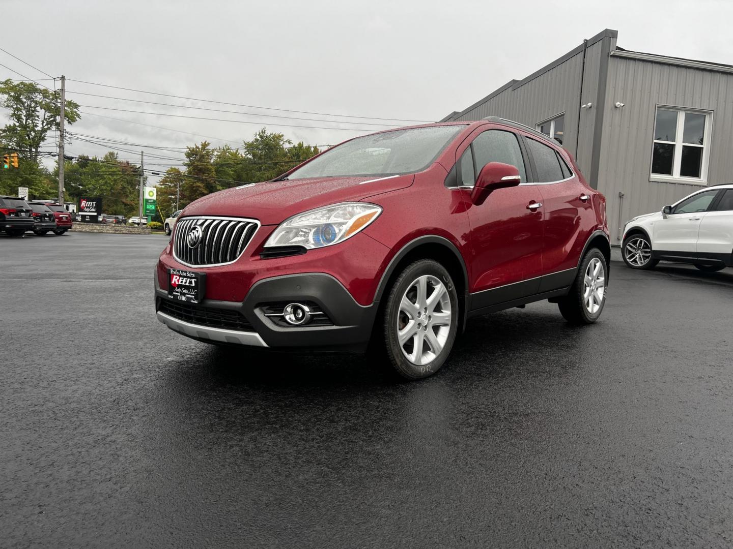 2015 Red /Gray Buick Encore Premium AWD (KL4CJHSBXFB) with an 1.4L I4 DOHC 16V TURBO engine, 6-Speed Automatic transmission, located at 11115 Chardon Rd. , Chardon, OH, 44024, (440) 214-9705, 41.580246, -81.241943 - Photo#0