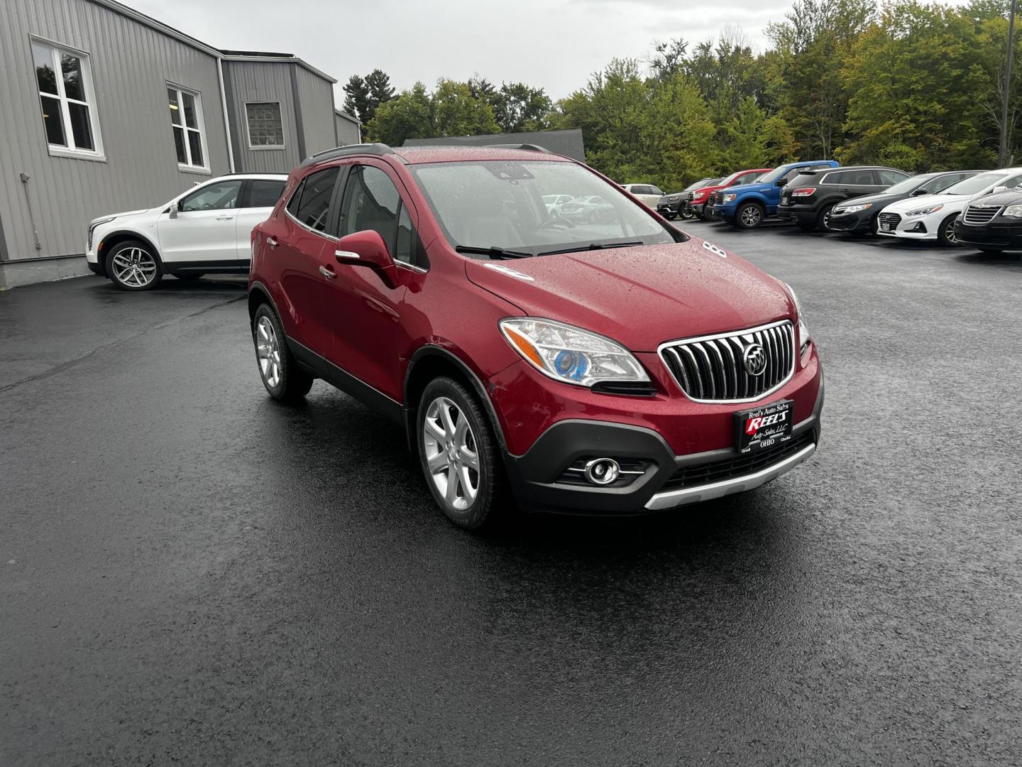 2015 Red /Gray Buick Encore Premium AWD (KL4CJHSBXFB) with an 1.4L I4 DOHC 16V TURBO engine, 6-Speed Automatic transmission, located at 11115 Chardon Rd. , Chardon, OH, 44024, (440) 214-9705, 41.580246, -81.241943 - Photo#1