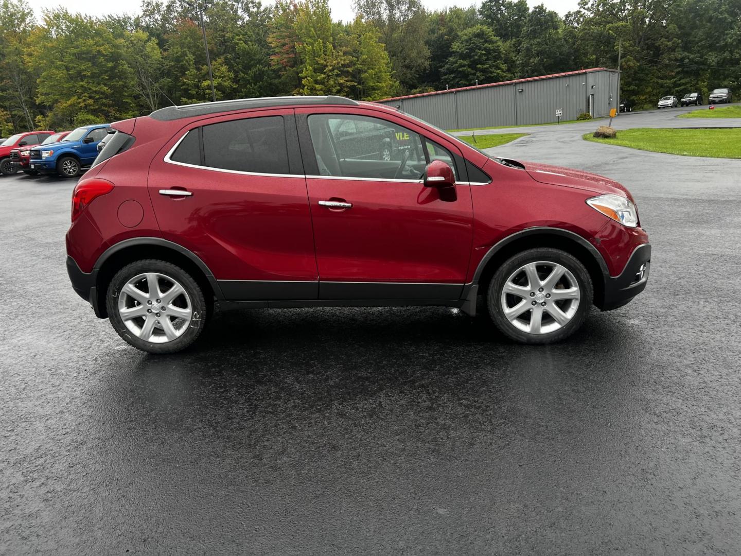 2015 Red /Gray Buick Encore Premium AWD (KL4CJHSBXFB) with an 1.4L I4 DOHC 16V TURBO engine, 6-Speed Automatic transmission, located at 11115 Chardon Rd. , Chardon, OH, 44024, (440) 214-9705, 41.580246, -81.241943 - Photo#6