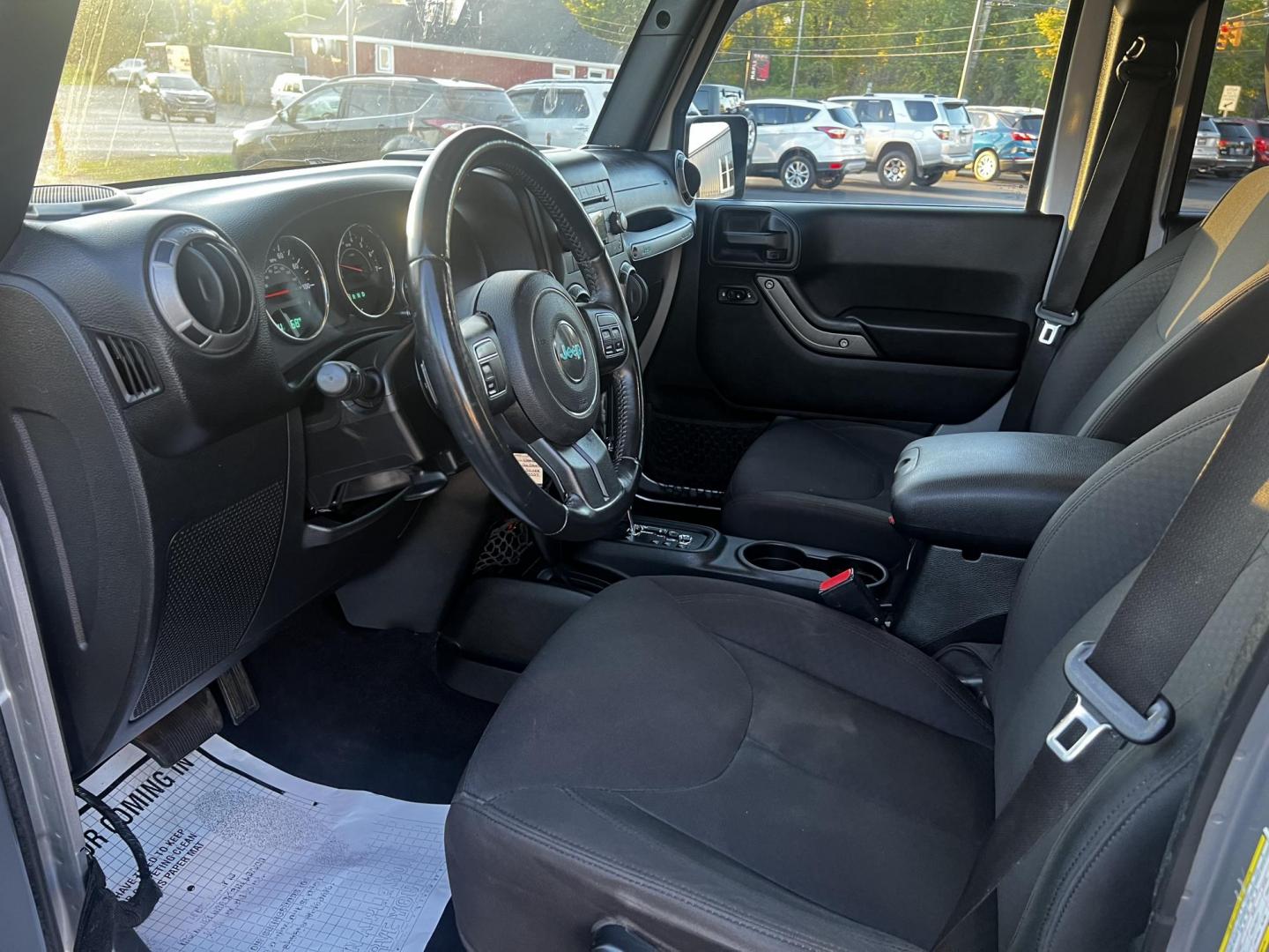 2016 Silver /Black Jeep Wrangler Unlimited Sport 4WD (1C4HJWDG7GL) with an 3.6L V6 DOHC 24V engine, 5-Speed Automatic transmission, located at 547 E. Main St., Orwell, OH, 44076, (440) 437-5893, 41.535435, -80.847855 - This 2016 Jeep Wrangler Unlimited Sport S is equipped with robust off-road capabilities and practical features. It houses a 3.6-liter Pentastar V6 engine paired with a 5-speed automatic transmission, offering a solid balance between on-road comfort and rugged performance. Notably equipped with LED h - Photo#15