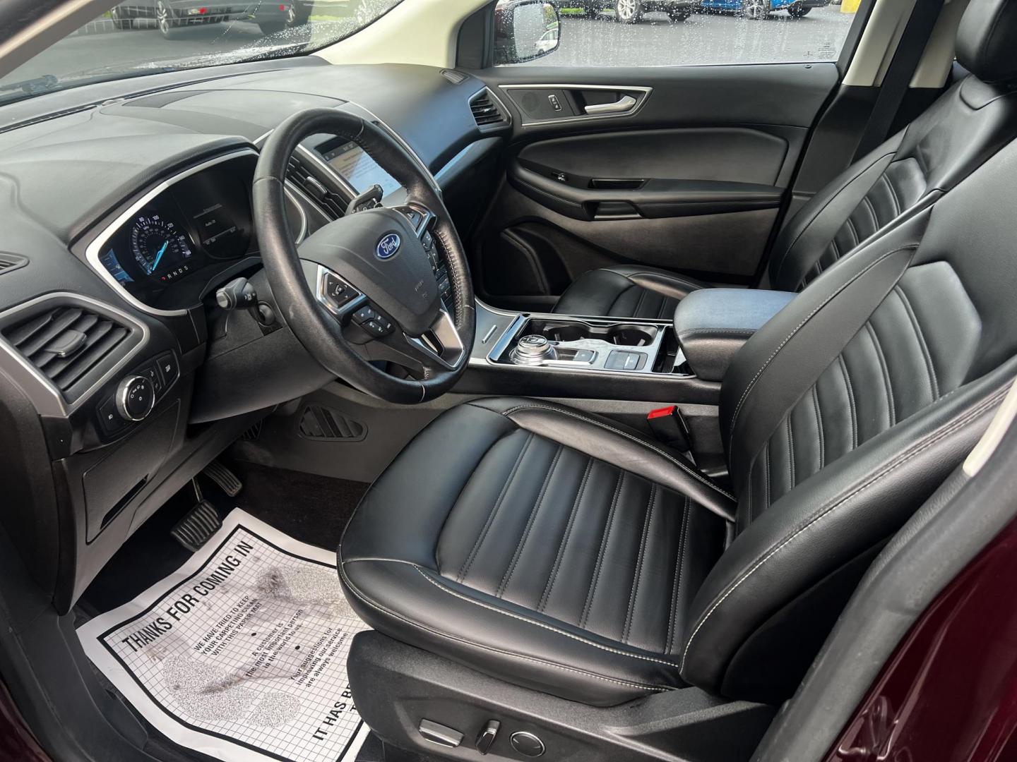 2019 Burgundy /Black Ford Edge SEL AWD (2FMPK4J96KB) with an 2.0L I4 DOHC 16V Turbo engine, 8-Speed Automatic transmission, located at 11115 Chardon Rd. , Chardon, OH, 44024, (440) 214-9705, 41.580246, -81.241943 - This One Owner 2019 Ford Edge SEL AWD is a sophisticated midsize SUV combining performance, technology, and comfort. It features a 2.0-liter turbocharged I4 EcoBoost engine with a 8-speed automatic transmission, providing a balanced driving experience with efficiency and power. The interior is well- - Photo#17