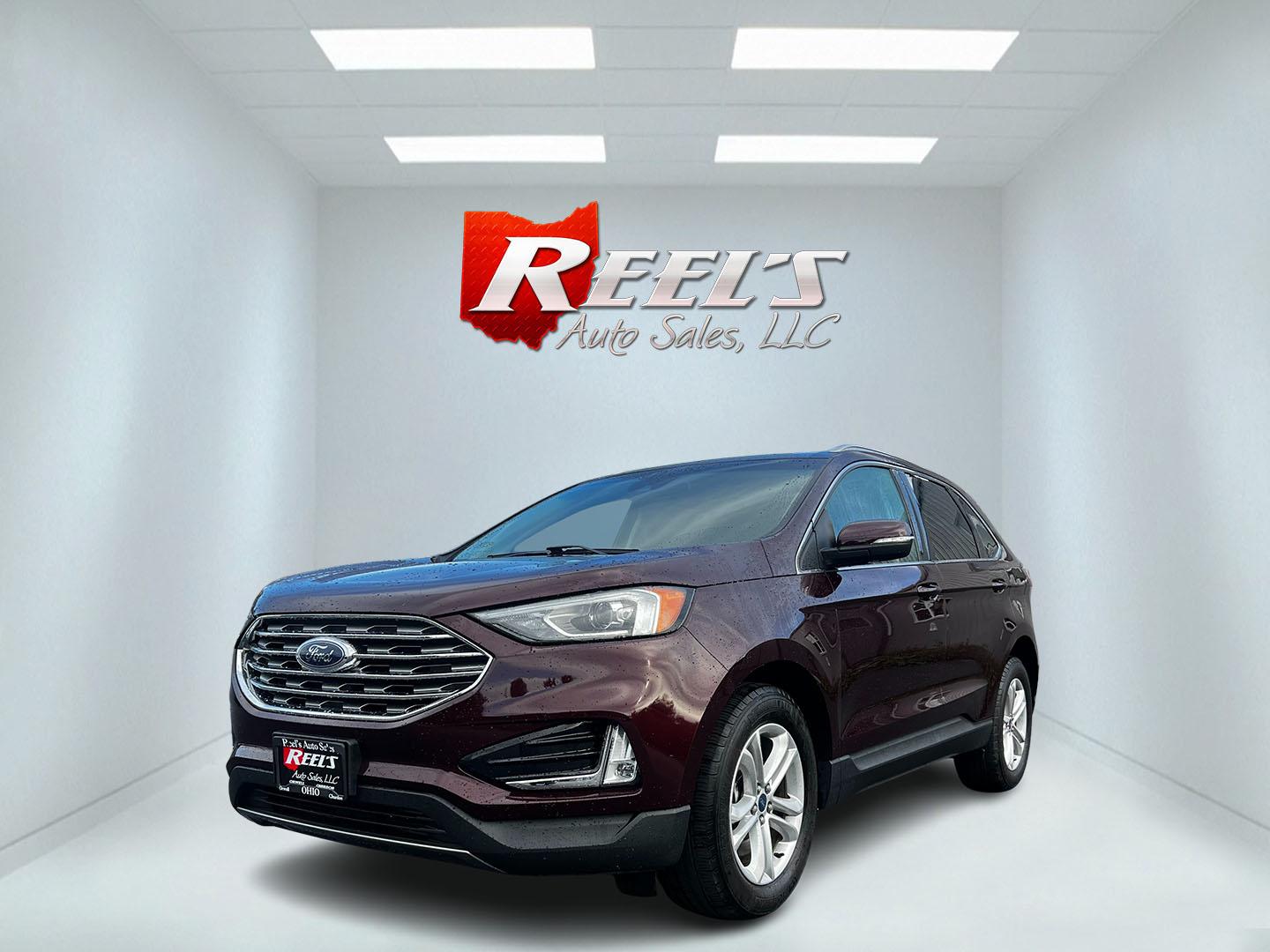 2019 Burgundy /Black Ford Edge SEL AWD (2FMPK4J96KB) with an 2.0L I4 DOHC 16V Turbo engine, 8-Speed Automatic transmission, located at 11115 Chardon Rd. , Chardon, OH, 44024, (440) 214-9705, 41.580246, -81.241943 - This One Owner 2019 Ford Edge SEL AWD is a sophisticated midsize SUV combining performance, technology, and comfort. It features a 2.0-liter turbocharged I4 EcoBoost engine with a 8-speed automatic transmission, providing a balanced driving experience with efficiency and power. The interior is well- - Photo#0