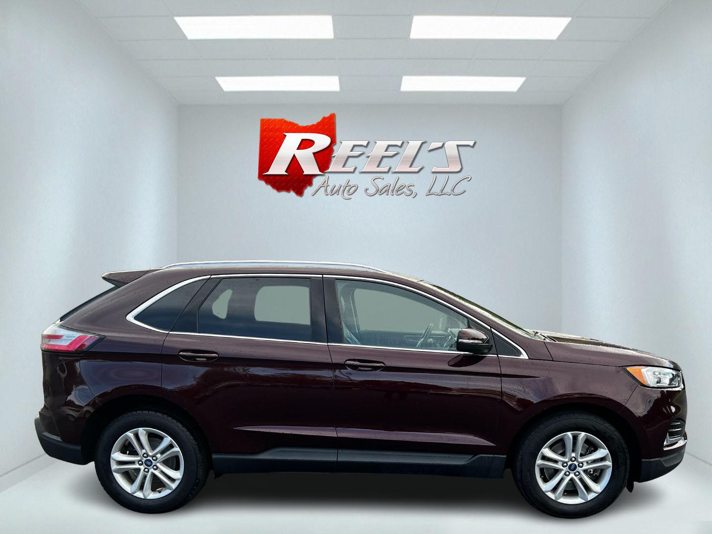 2019 Burgundy /Black Ford Edge SEL AWD (2FMPK4J96KB) with an 2.0L I4 DOHC 16V Turbo engine, 8-Speed Automatic transmission, located at 11115 Chardon Rd. , Chardon, OH, 44024, (440) 214-9705, 41.580246, -81.241943 - This One Owner 2019 Ford Edge SEL AWD is a sophisticated midsize SUV combining performance, technology, and comfort. It features a 2.0-liter turbocharged I4 EcoBoost engine with a 8-speed automatic transmission, providing a balanced driving experience with efficiency and power. The interior is well- - Photo#4