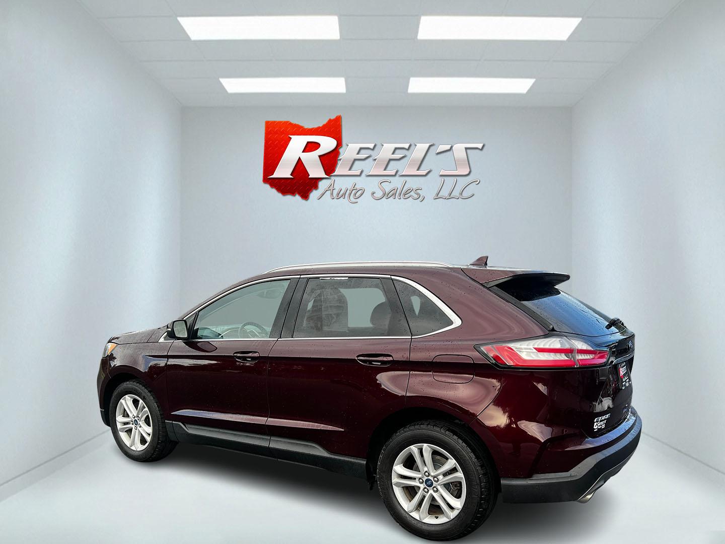 2019 Burgundy /Black Ford Edge SEL AWD (2FMPK4J96KB) with an 2.0L I4 DOHC 16V Turbo engine, 8-Speed Automatic transmission, located at 11115 Chardon Rd. , Chardon, OH, 44024, (440) 214-9705, 41.580246, -81.241943 - This One Owner 2019 Ford Edge SEL AWD is a sophisticated midsize SUV combining performance, technology, and comfort. It features a 2.0-liter turbocharged I4 EcoBoost engine with a 8-speed automatic transmission, providing a balanced driving experience with efficiency and power. The interior is well- - Photo#8