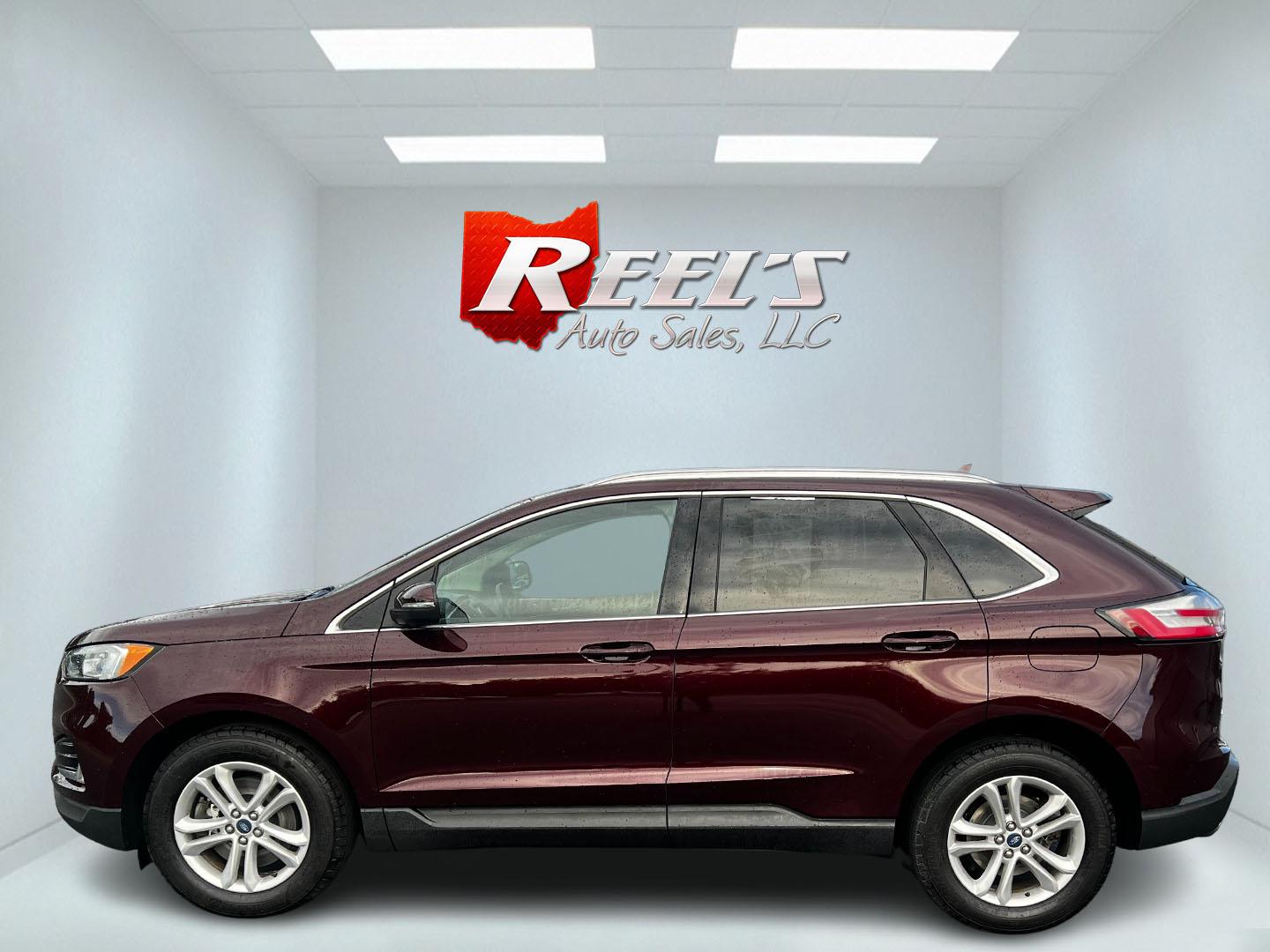 2019 Burgundy /Black Ford Edge SEL AWD (2FMPK4J96KB) with an 2.0L I4 DOHC 16V Turbo engine, 8-Speed Automatic transmission, located at 11115 Chardon Rd. , Chardon, OH, 44024, (440) 214-9705, 41.580246, -81.241943 - This One Owner 2019 Ford Edge SEL AWD is a sophisticated midsize SUV combining performance, technology, and comfort. It features a 2.0-liter turbocharged I4 EcoBoost engine with a 8-speed automatic transmission, providing a balanced driving experience with efficiency and power. The interior is well- - Photo#9