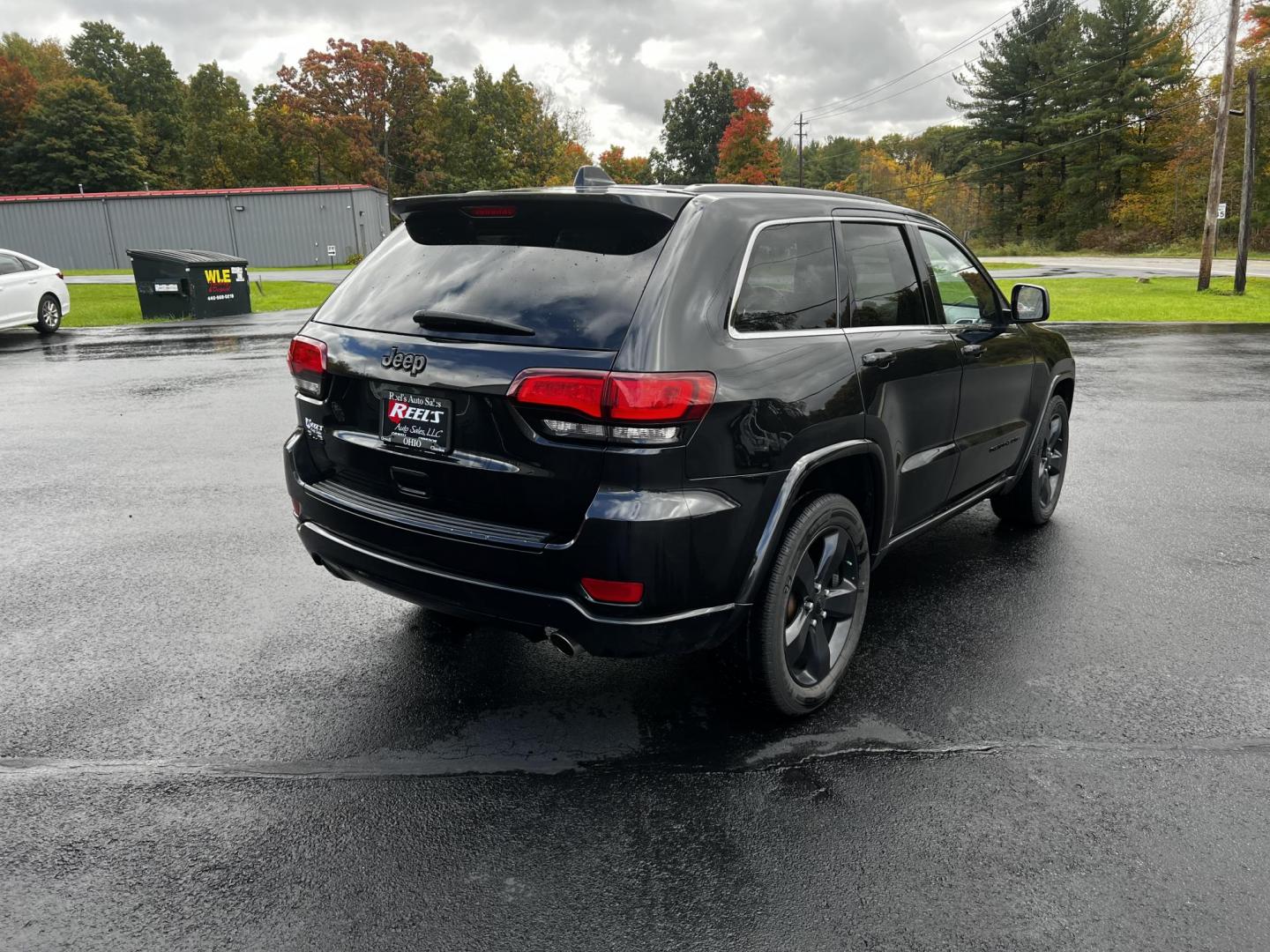 2015 Black /Black Jeep Grand Cherokee Altitude 4WD (1C4RJFAG1FC) with an 3.6L V6 DOHC 24V FFV engine, 8-Speed Automatic transmission, located at 547 E. Main St., Orwell, OH, 44076, (440) 437-5893, 41.535435, -80.847855 - Photo#12