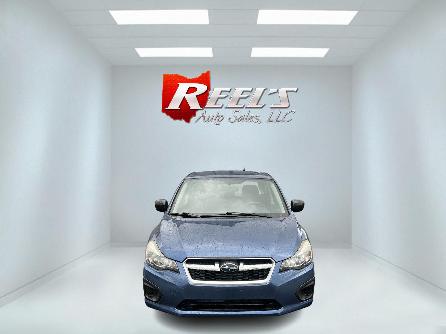 2013 Blue /Black Subaru Impreza 2.0i Premium 4-Door w/All Weather Package (JF1GJAC68DH) with an 2.0L H4 DOHC 16V engine, Automatic transmission, located at 11115 Chardon Rd. , Chardon, OH, 44024, (440) 214-9705, 41.580246, -81.241943 - This 2013 Subaru Impreza Premium offers a balanced combination of efficiency and all-weather capability, featuring a 2.0-liter H4 PZEV engine that achieves an impressive 35 MPG on the highway. This model is equipped with Subaru's renowned Symmetrical All-Wheel Drive system, delivering enhanced stabi - Photo#1