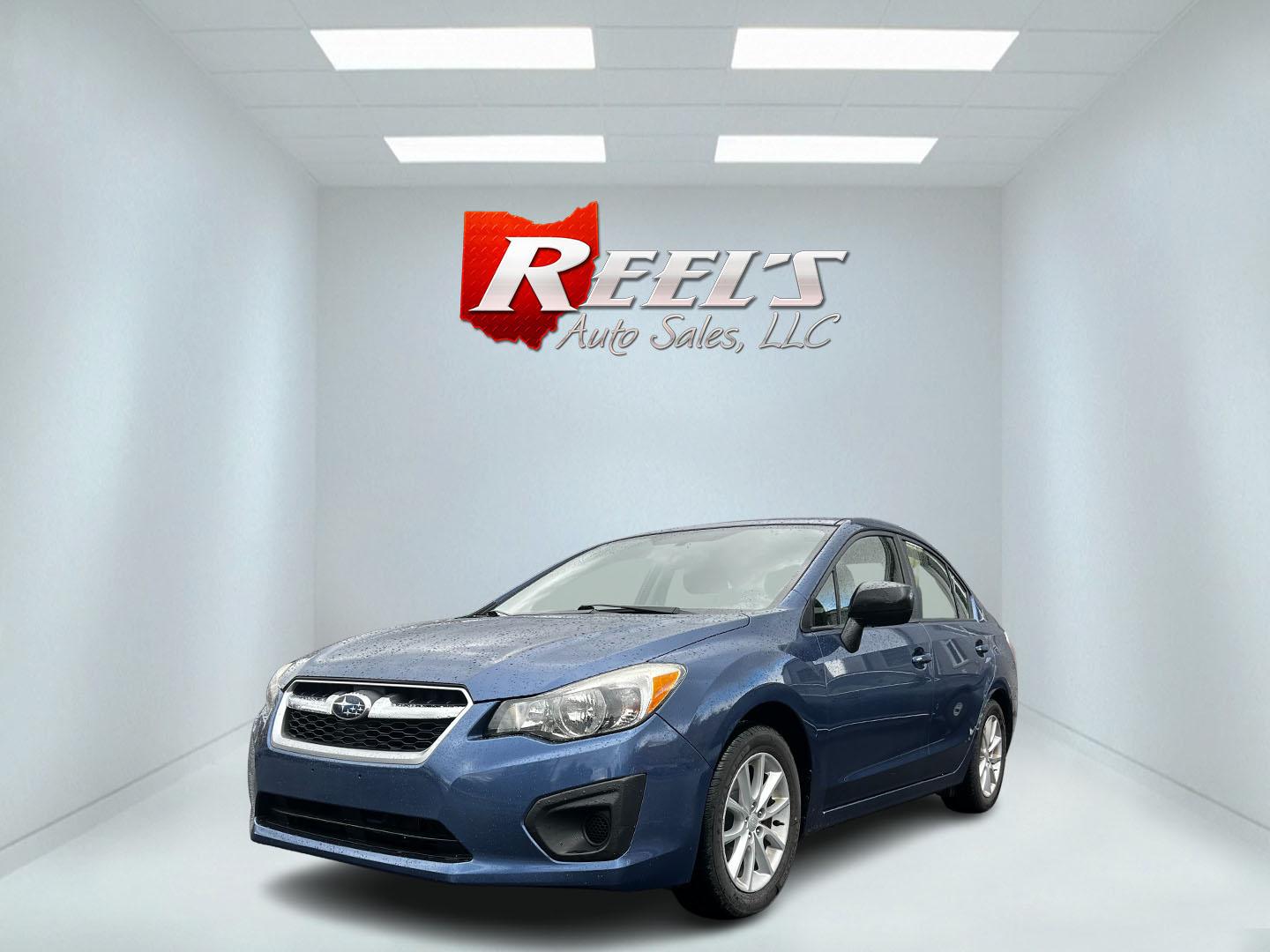 2013 Blue /Black Subaru Impreza 2.0i Premium 4-Door w/All Weather Package (JF1GJAC68DH) with an 2.0L H4 DOHC 16V engine, Automatic transmission, located at 11115 Chardon Rd. , Chardon, OH, 44024, (440) 214-9705, 41.580246, -81.241943 - This 2013 Subaru Impreza Premium offers a balanced combination of efficiency and all-weather capability, featuring a 2.0-liter H4 PZEV engine that achieves an impressive 35 MPG on the highway. This model is equipped with Subaru's renowned Symmetrical All-Wheel Drive system, delivering enhanced stabi - Photo#0