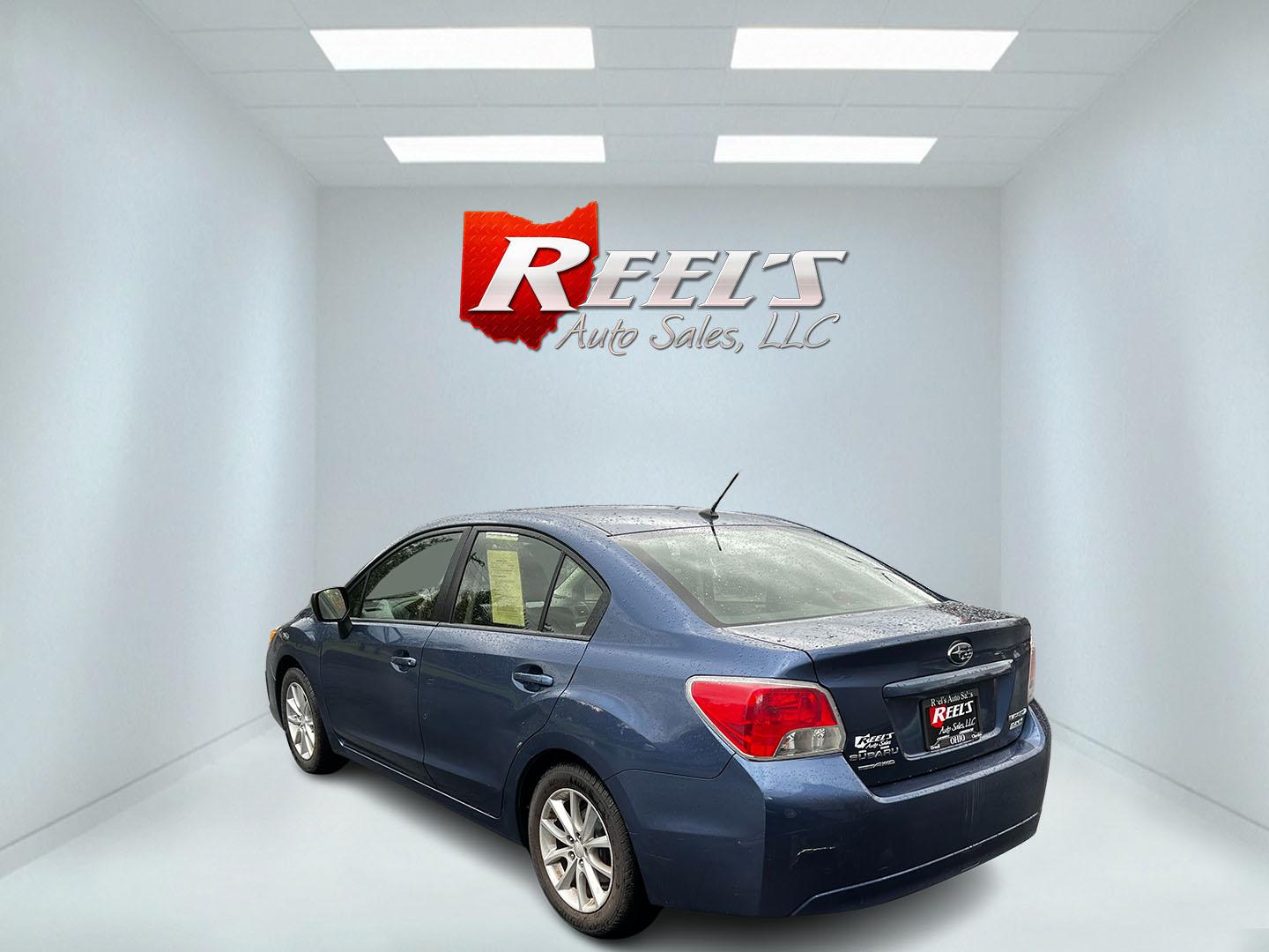 2013 Blue /Black Subaru Impreza 2.0i Premium 4-Door w/All Weather Package (JF1GJAC68DH) with an 2.0L H4 DOHC 16V engine, Automatic transmission, located at 11115 Chardon Rd. , Chardon, OH, 44024, (440) 214-9705, 41.580246, -81.241943 - This 2013 Subaru Impreza Premium offers a balanced combination of efficiency and all-weather capability, featuring a 2.0-liter H4 PZEV engine that achieves an impressive 35 MPG on the highway. This model is equipped with Subaru's renowned Symmetrical All-Wheel Drive system, delivering enhanced stabi - Photo#7