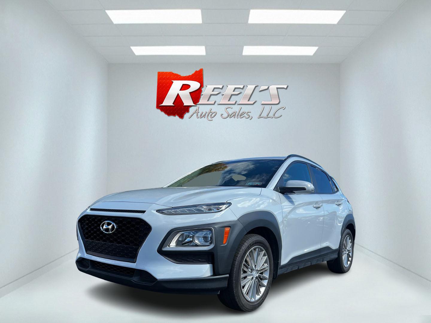 2019 White /Black Hyundai Kona SEL AWD (KM8K2CAA7KU) with an 2.0L I4 DOHC 16V engine, 6 Speed Automatic transmission, located at 547 E. Main St., Orwell, OH, 44076, (440) 437-5893, 41.535435, -80.847855 - This One Owner 2019 Hyundai Kona SEL AWD is a compact SUV that combines efficiency, safety, and technology features. Powered by a 2.0-liter I4 Atkinson engine coupled with a 6-speed automatic transmission, it delivers a commendable fuel efficiency of approximately 30 MPG on the highway. It is equipp - Photo#0