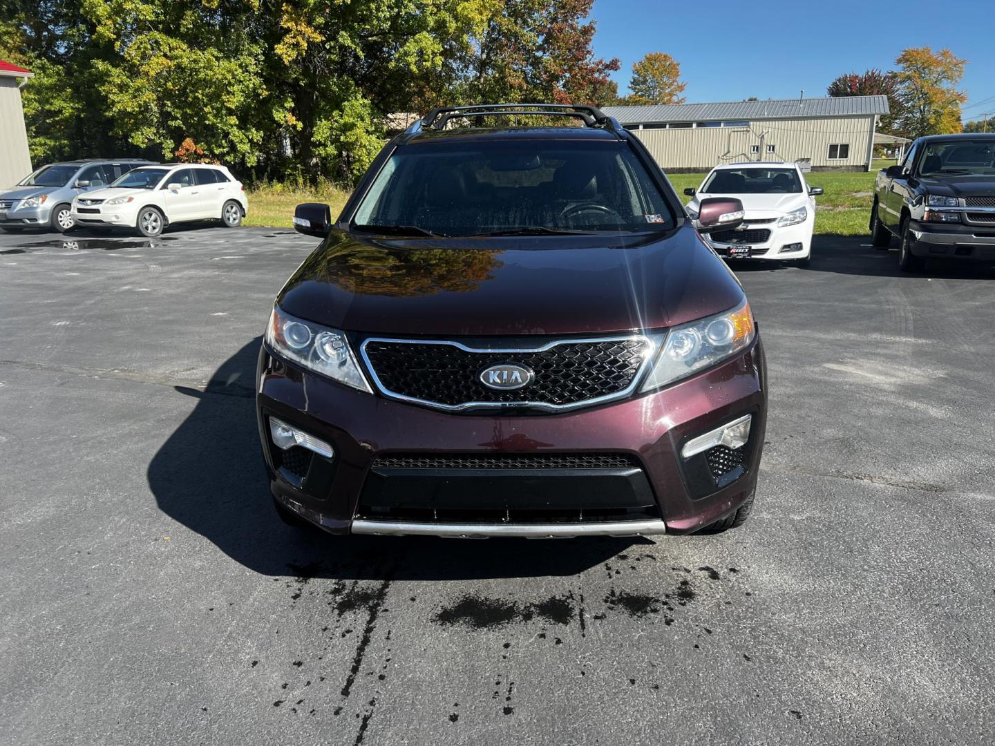 2013 Burgundy /Black Kia Sorento SX 4WD (5XYKWDA25DG) with an 3.5L V6 DOHC 24V engine, 6-Speed Automatic transmission, located at 547 E. Main St., Orwell, OH, 44076, (440) 437-5893, 41.535435, -80.847855 - Photo#1