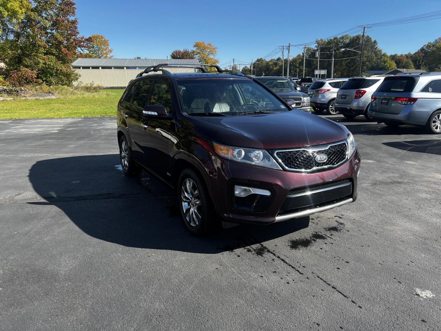 2013 Burgundy /Black Kia Sorento SX 4WD (5XYKWDA25DG) with an 3.5L V6 DOHC 24V engine, 6-Speed Automatic transmission, located at 547 E. Main St., Orwell, OH, 44076, (440) 437-5893, 41.535435, -80.847855 - Photo#2