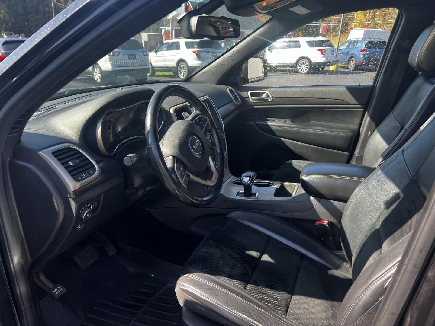 2015 Black /Black Jeep Grand Cherokee Altitude 4WD (1C4RJFAG4FC) with an 3.6L V6 DOHC 24V FFV engine, 8-Speed Automatic transmission, located at 11115 Chardon Rd. , Chardon, OH, 44024, (440) 214-9705, 41.580246, -81.241943 - Photo#14