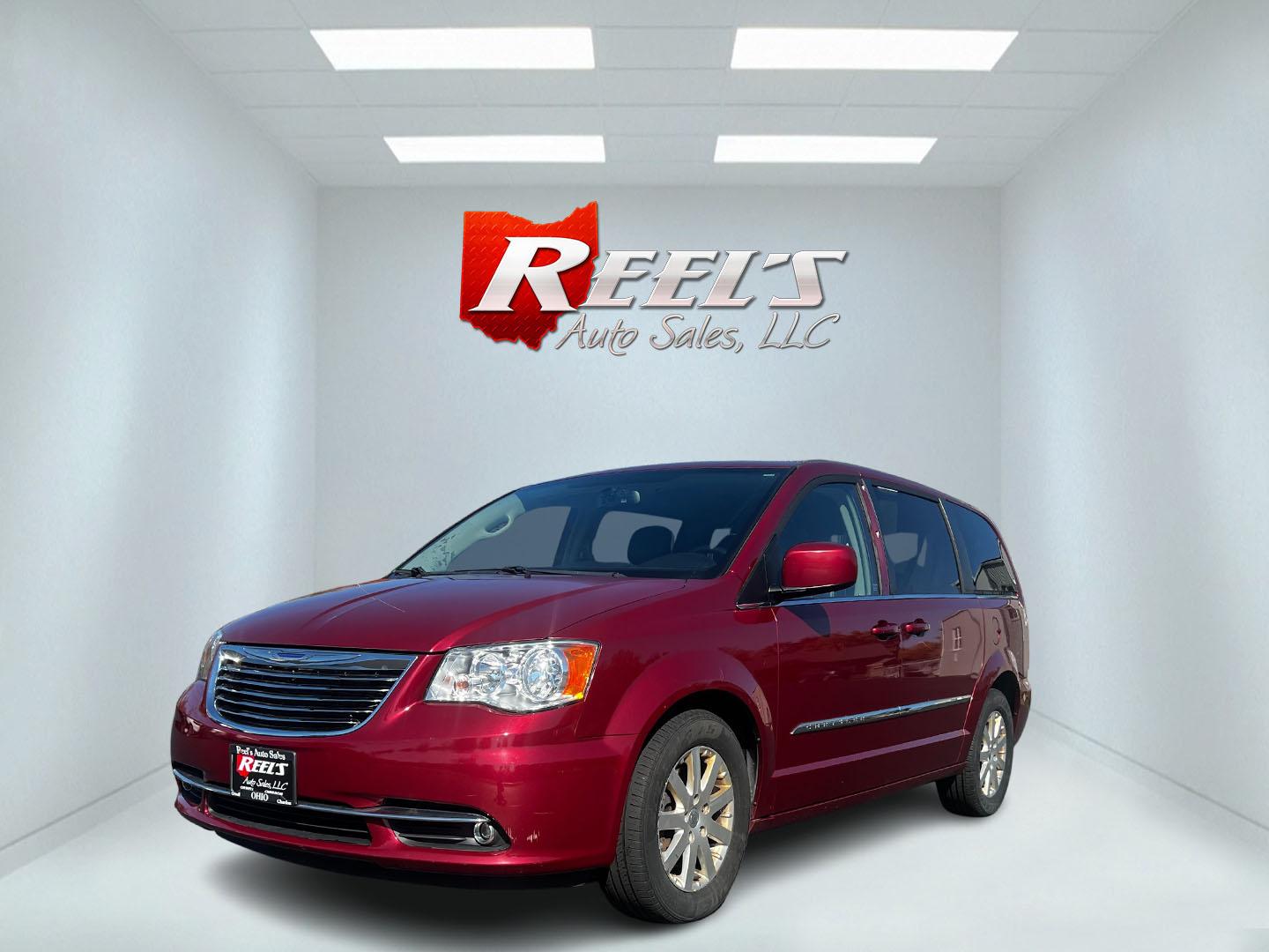 2015 Red /Black Chrysler Town & Country Touring (2C4RC1BG1FR) with an 3.6L V6 DOHC 24V FFV engine, 6-Speed Automatic transmission, located at 547 E. Main St., Orwell, OH, 44076, (440) 437-5893, 41.535435, -80.847855 - This 2015 Chrysler Town & Country Touring is a versatile minivan well-suited for families, offering a blend of comfort and utility. It is powered by a 3.6-liter Pentastar V6 engine paired with a 6-speed automatic transmission, ensuring a smooth and responsive driving experience. The interior is desi - Photo#0