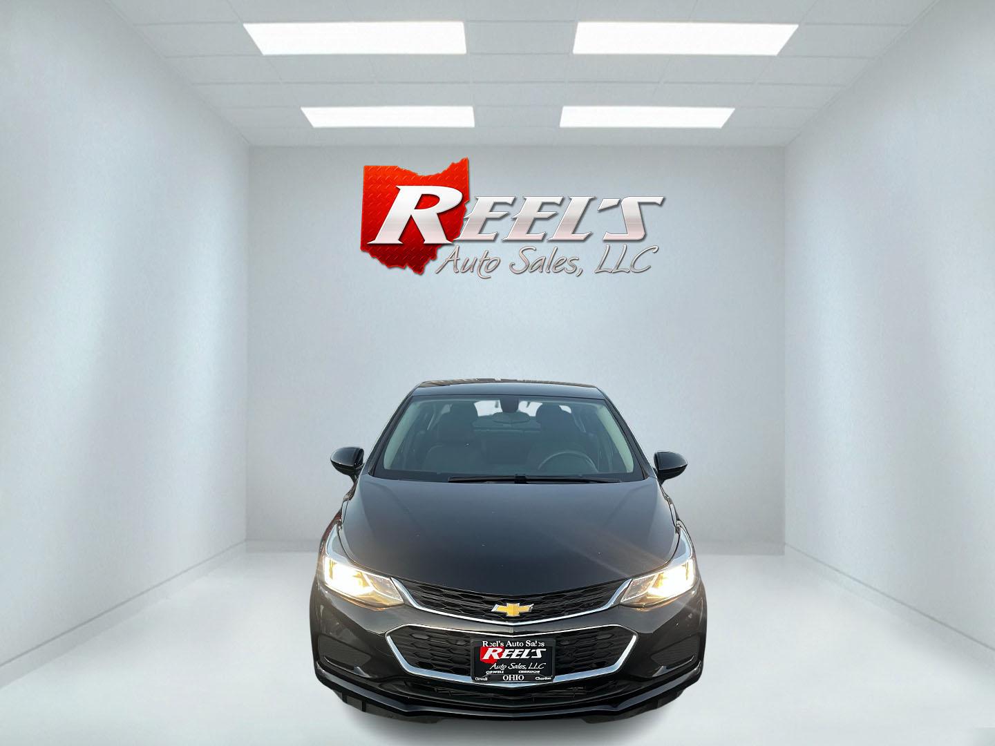 2018 Black /Black Chevrolet Cruze LT Auto (1G1BE5SM4J7) with an 1.4L I4 DOHC 16V TURBO engine, 6A transmission, located at 11115 Chardon Rd. , Chardon, OH, 44024, (440) 214-9705, 41.580246, -81.241943 - This 2018 Chevrolet Cruze LT is equipped with a 1.4L Turbocharged EcoTec engine and a 6-speed automatic transmission. Noteworthy features include LED daytime running lights, dusk-sensing headlights, and impressive fuel efficiency at 40 MPG on the highway. This model also offers modern connectivity w - Photo#1