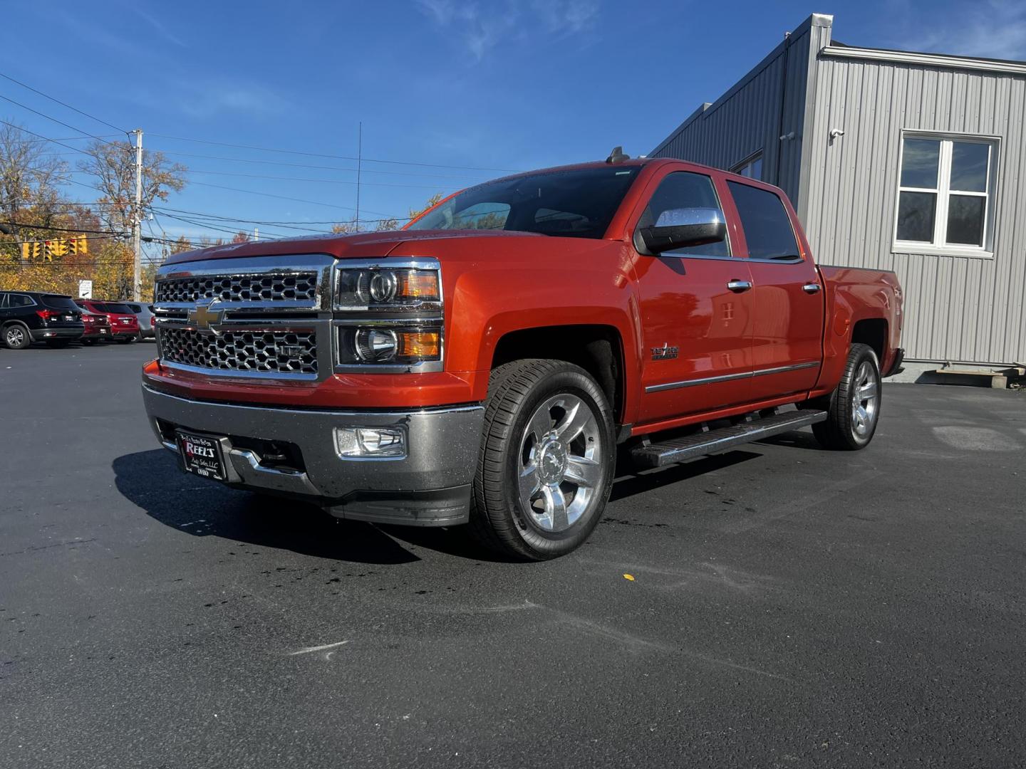 2015 Orange /Black Chevrolet Silverado 1500 LTZ Crew Cab 4WD (3GCUKSEC8FG) with an 5.3L V8 OHV 16V engine, 6-Speed Automatic transmission, located at 11115 Chardon Rd. , Chardon, OH, 44024, (440) 214-9705, 41.580246, -81.241943 - Photo#0