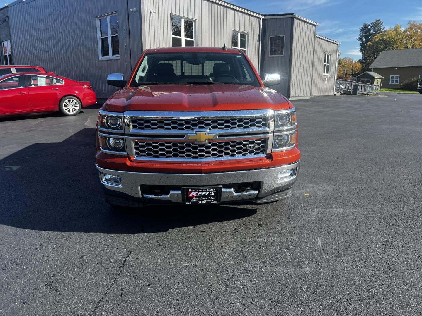 2015 Orange /Black Chevrolet Silverado 1500 LTZ Crew Cab 4WD (3GCUKSEC8FG) with an 5.3L V8 OHV 16V engine, 6-Speed Automatic transmission, located at 11115 Chardon Rd. , Chardon, OH, 44024, (440) 214-9705, 41.580246, -81.241943 - Photo#1